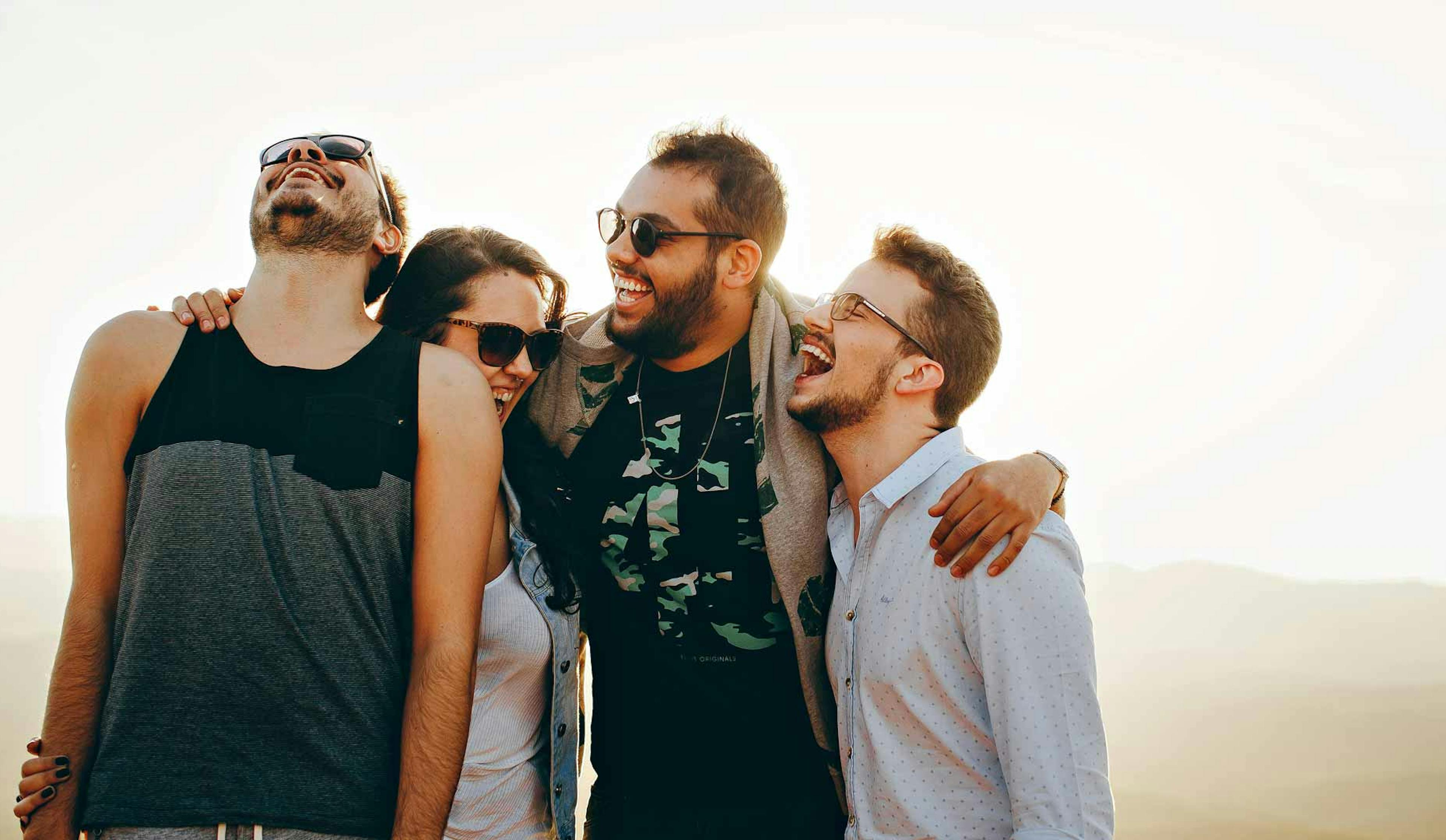 four friends laughing