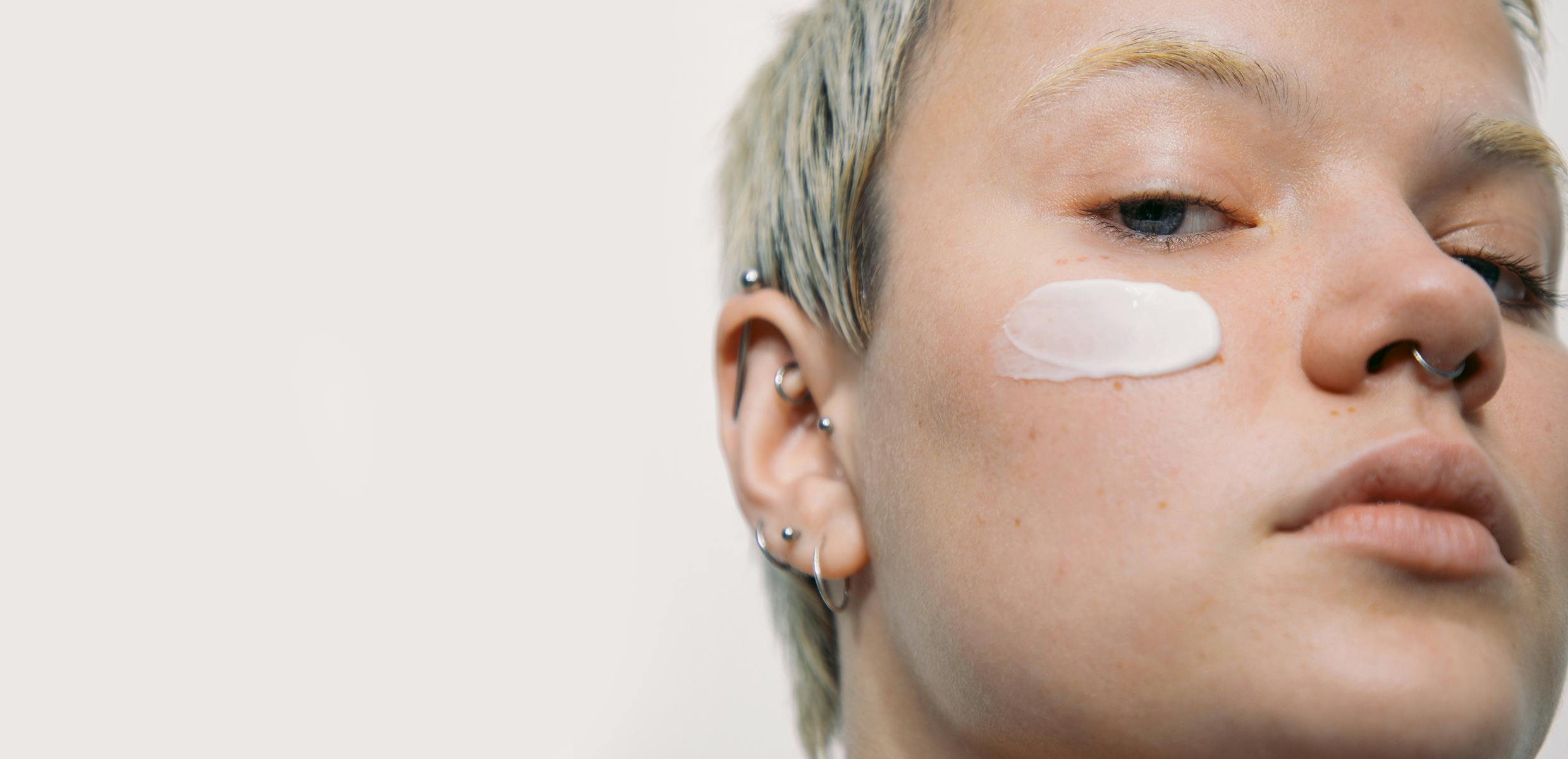 Photo of a model's face with The Outset's Restorative Niacinamide Night Cream on her face