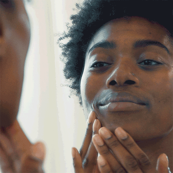 GIF of model using The Outset prep serum on her face