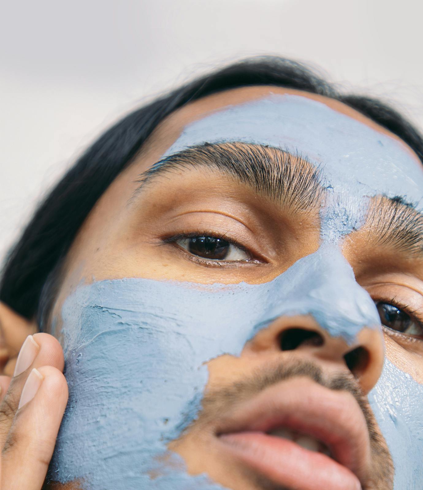 Photo of model with The Outset's Purifying Blue Clay Mask on his face