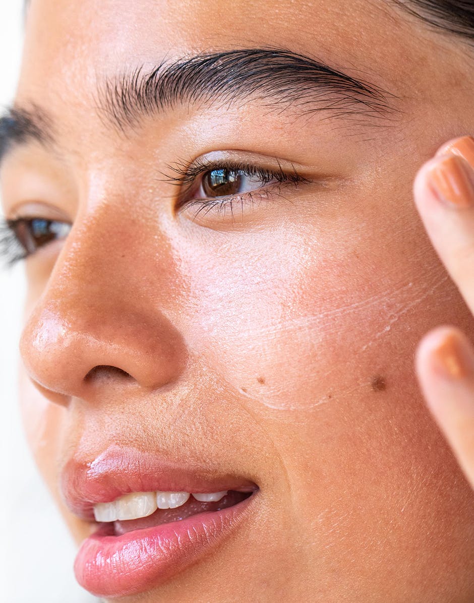 Photo of a model applying the Nourishing Squalane Daily Moisturizer