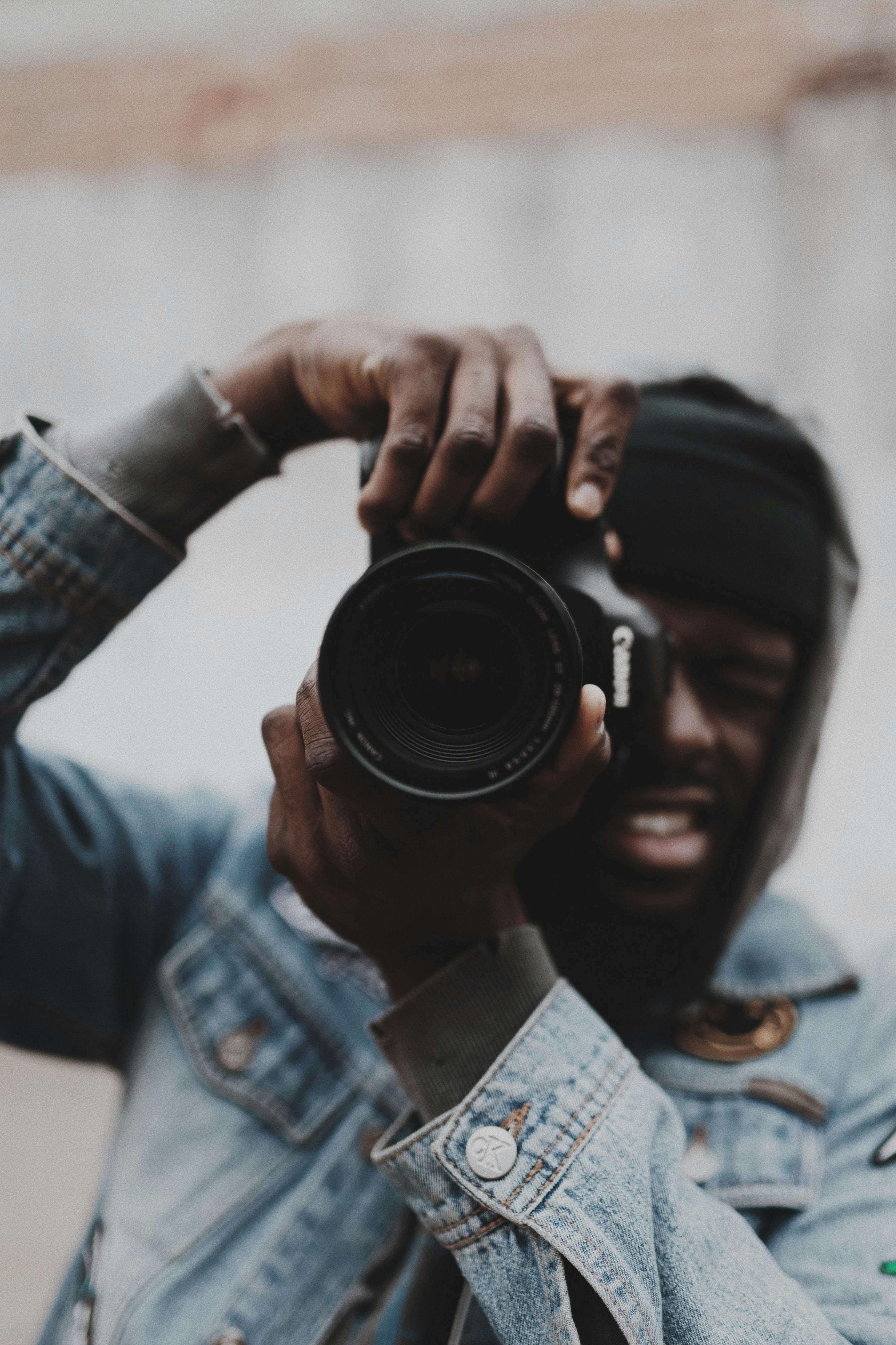 person holding a camera taking a picture.