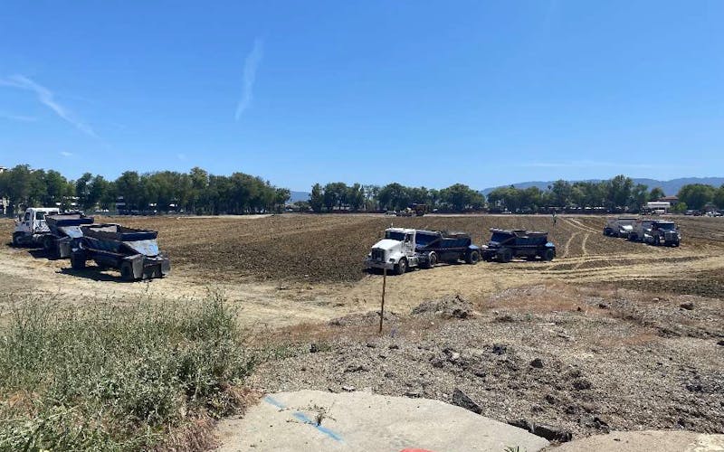 Trucks working on construction site at The Rise