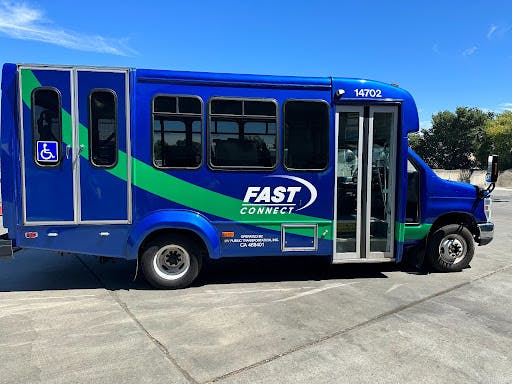 Image of FAST handi transit van parked in a parking lot.