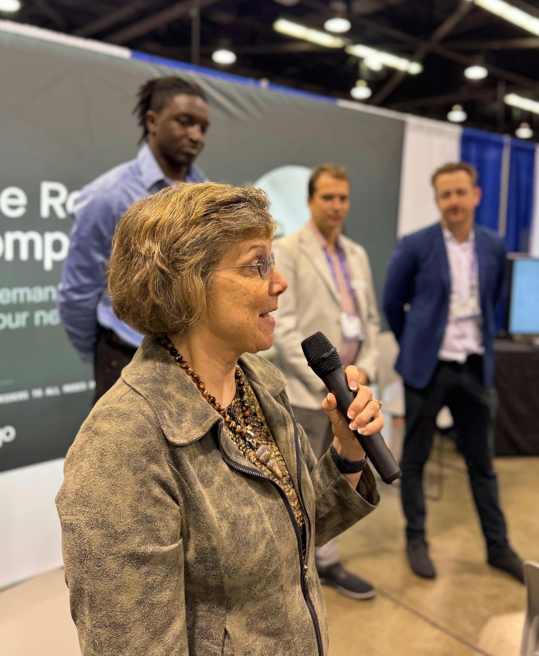 Pictured: Diane Feinstein speaks during the One Transit launch at APTA, alongside TRC's Dami Adebayo, Stephen Kuban, and James Cox.