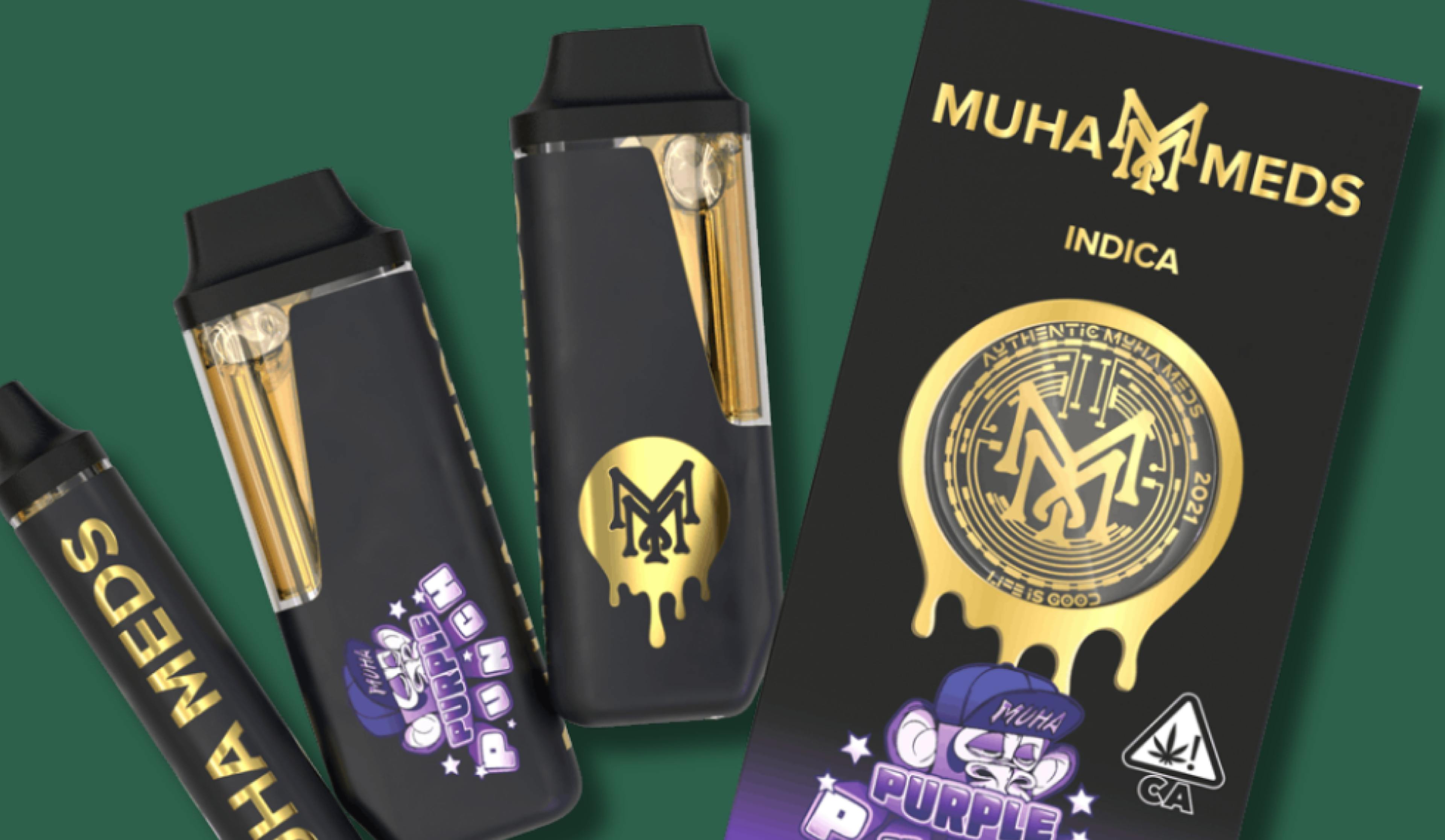 Product image of Muha Meds Purple Punch Indica vape cartridge packaging. The design features a black and gold theme with dripping gold accents and a purple graphic label. Includes a branded vape pen, two cartridges, and the retail box displaying 1000mg THC content and California compliance symbols.

