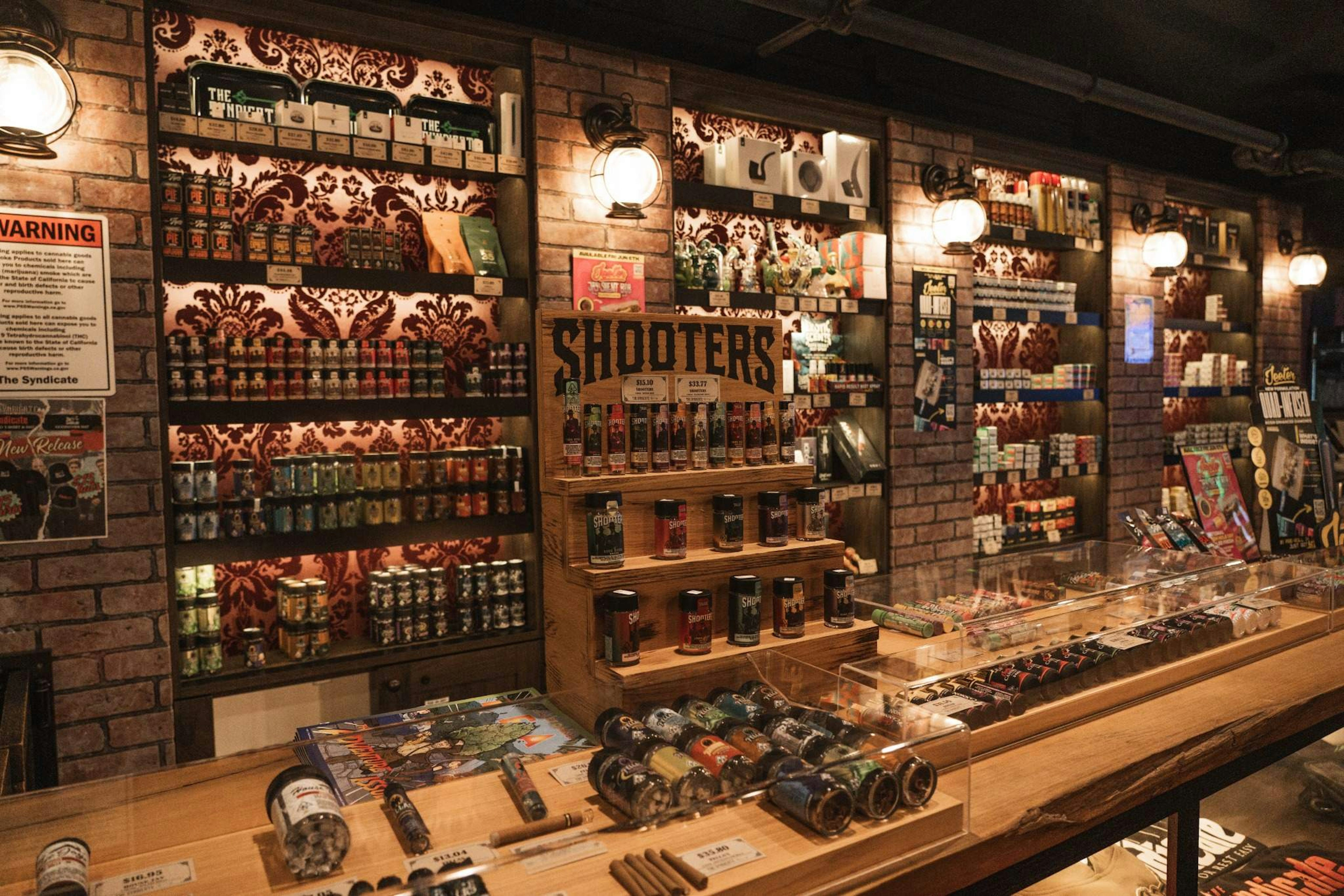 Wide interior shot of The Syndicate Huntington Park showing cannabis concentrates, accessories, and pre-rolls