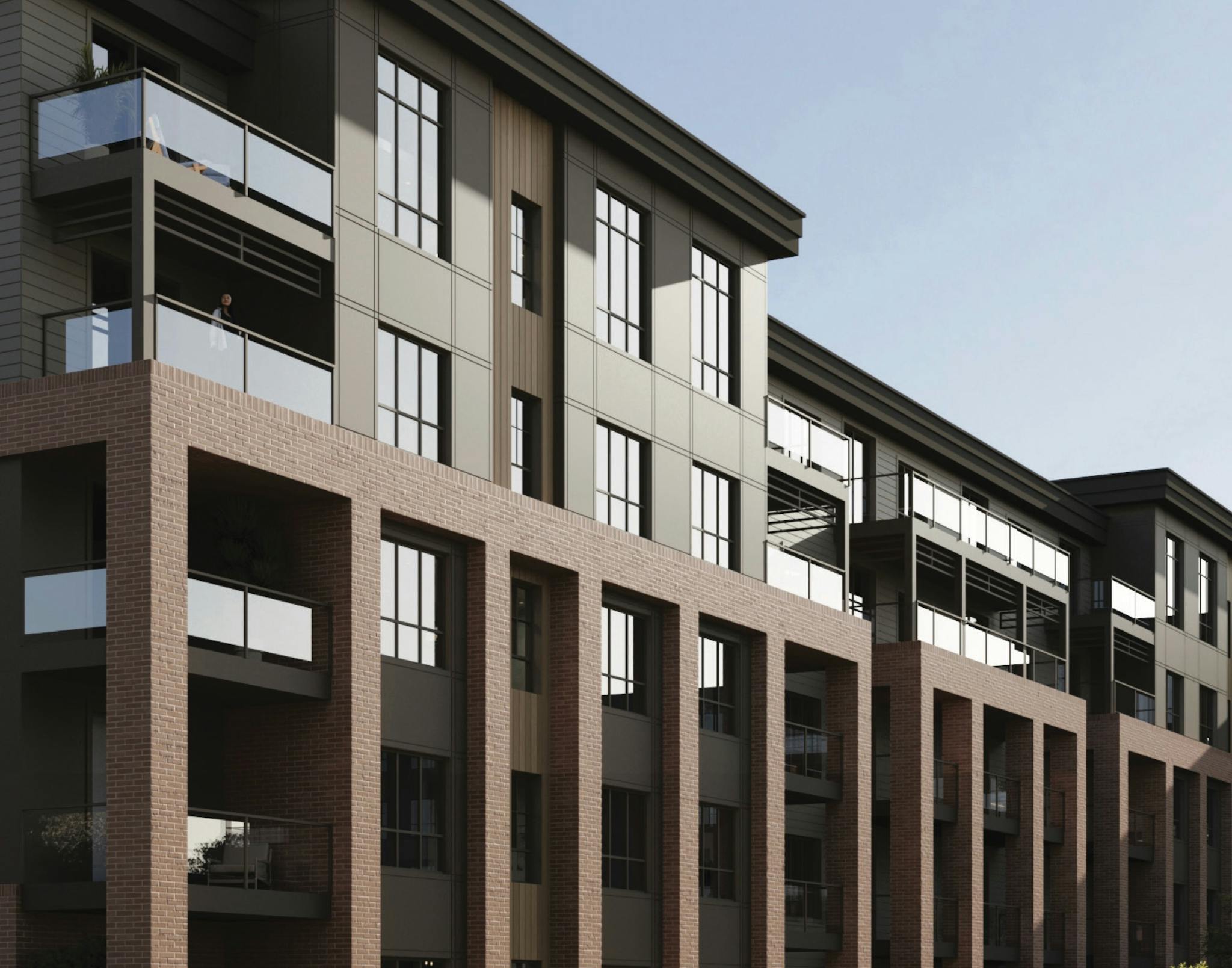 The Vintage apartments from an angled view, under a blue sky.