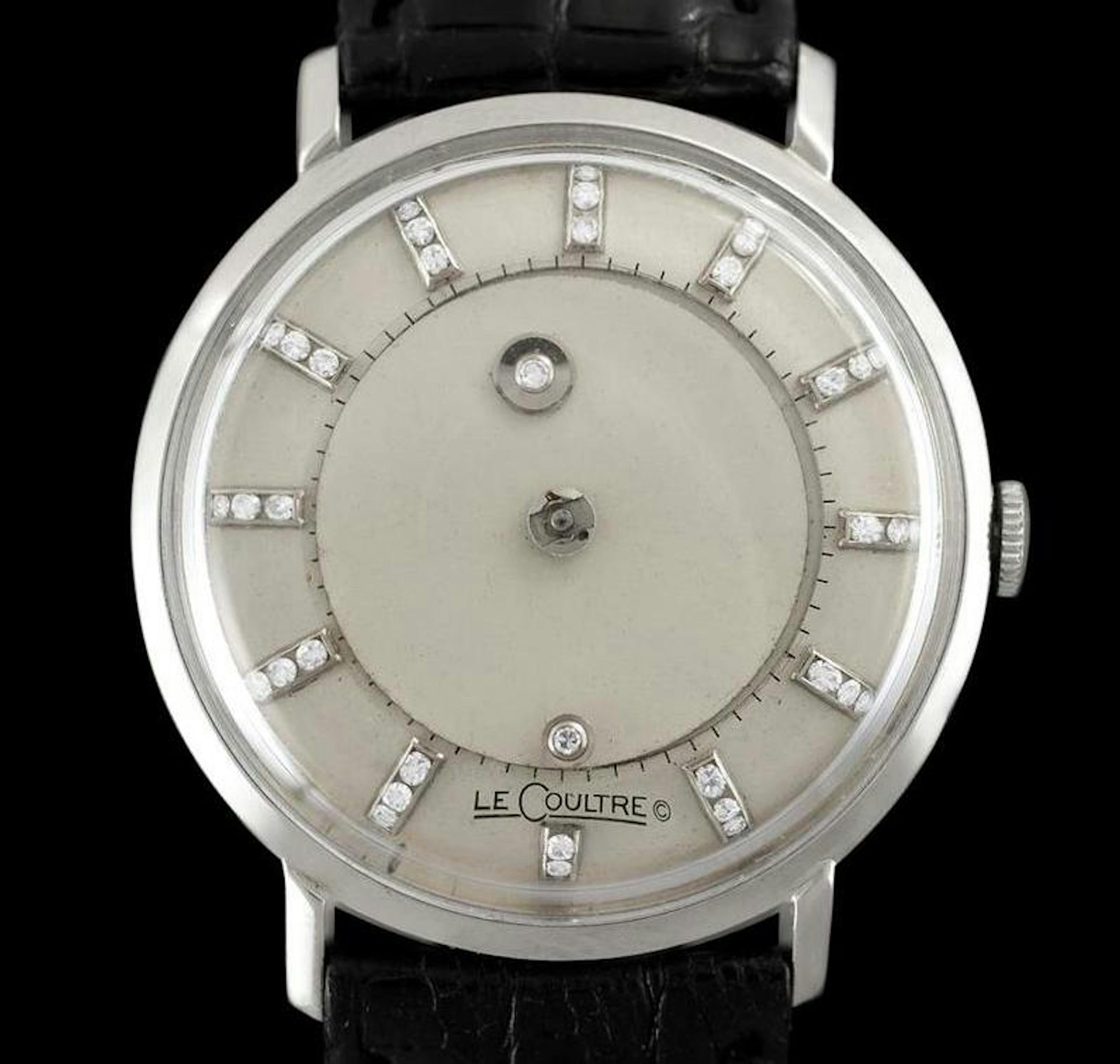 Close up of a mystery dial watch from JaegerLeCoulre with white dial diamond indices and steel case
