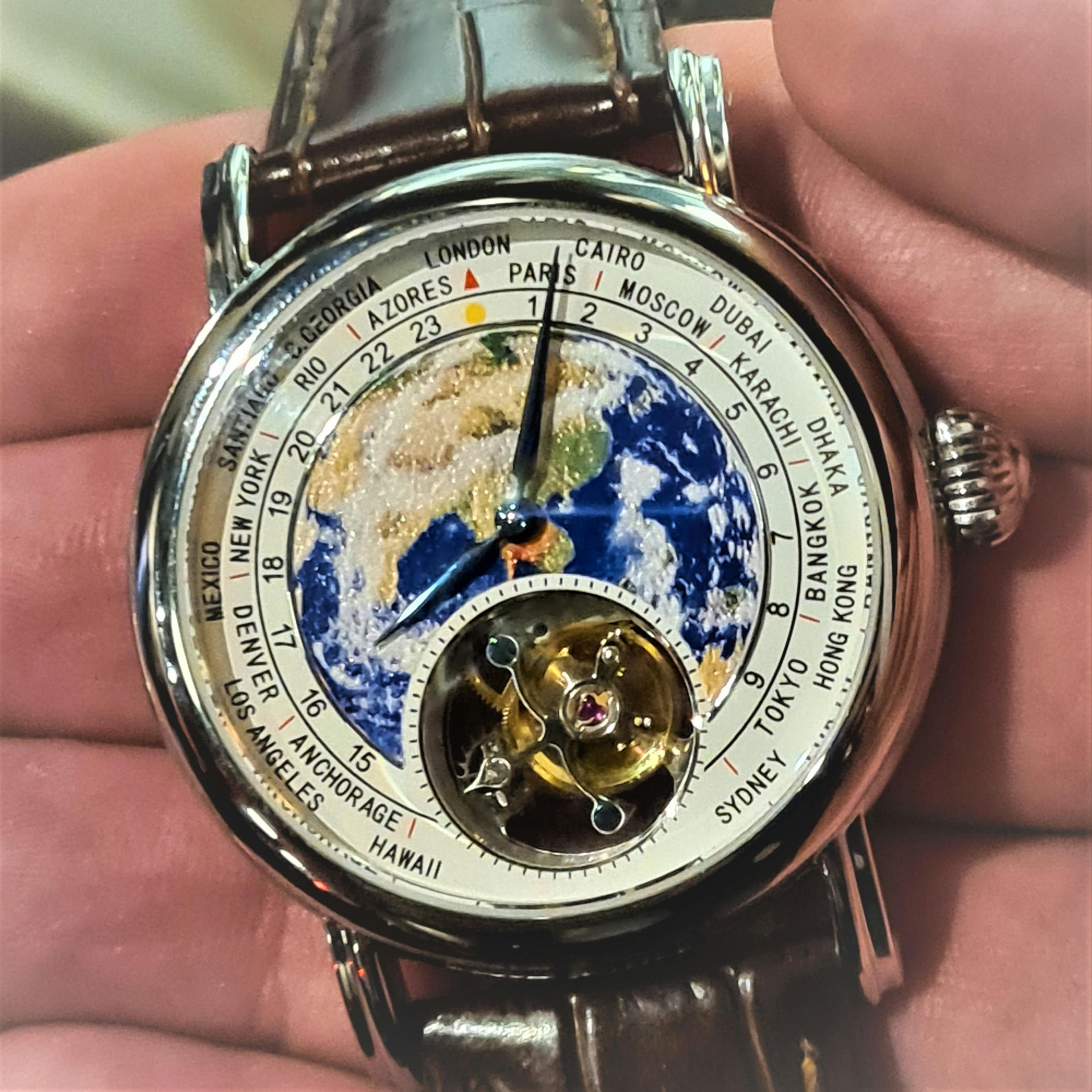 Modern Seagull watch wtih Tourbillon at the bottom. The Escapement rotates within the visible circle in order to offset the effects of gravity on the Balance.