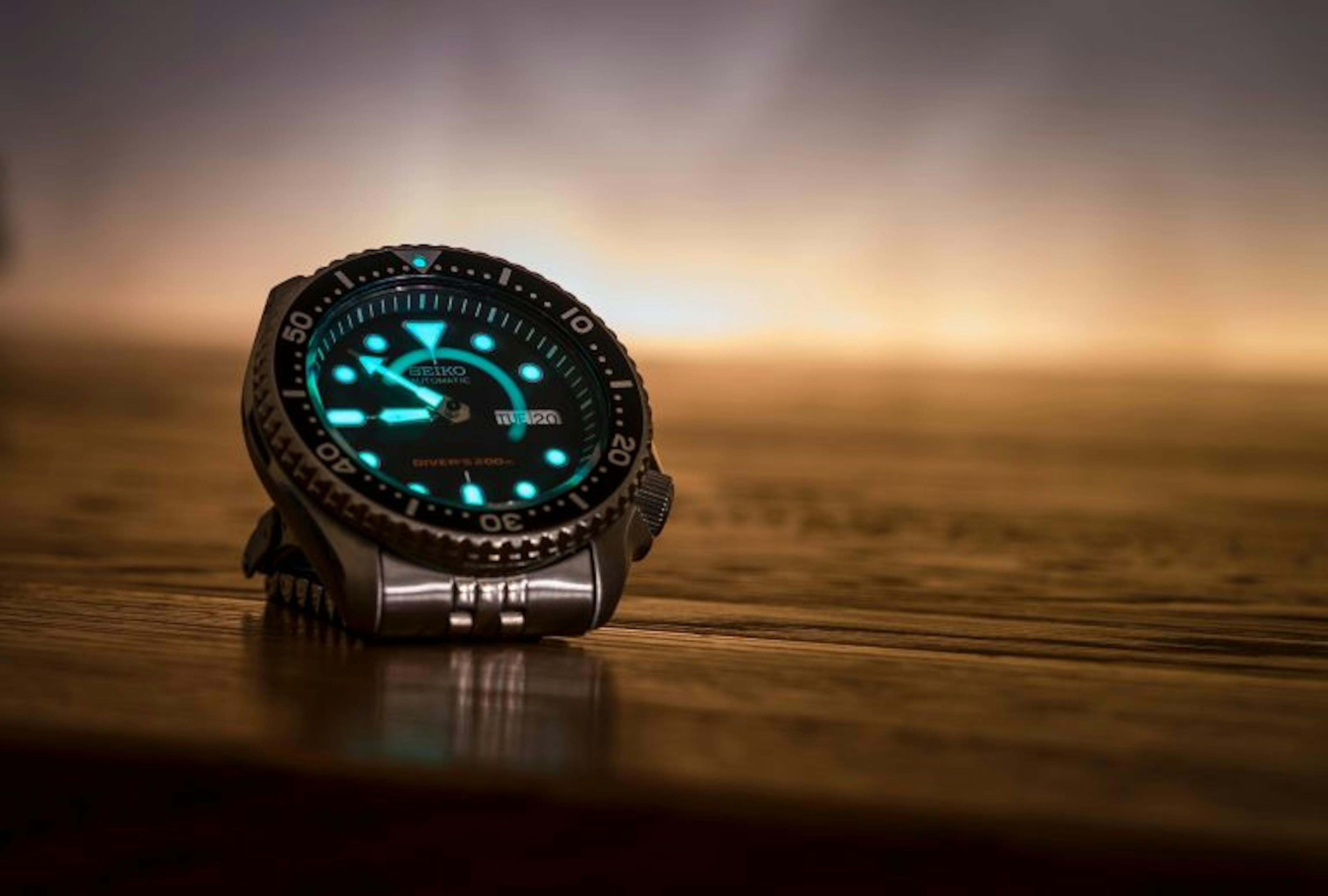Modern dive watch showing luminous dial details