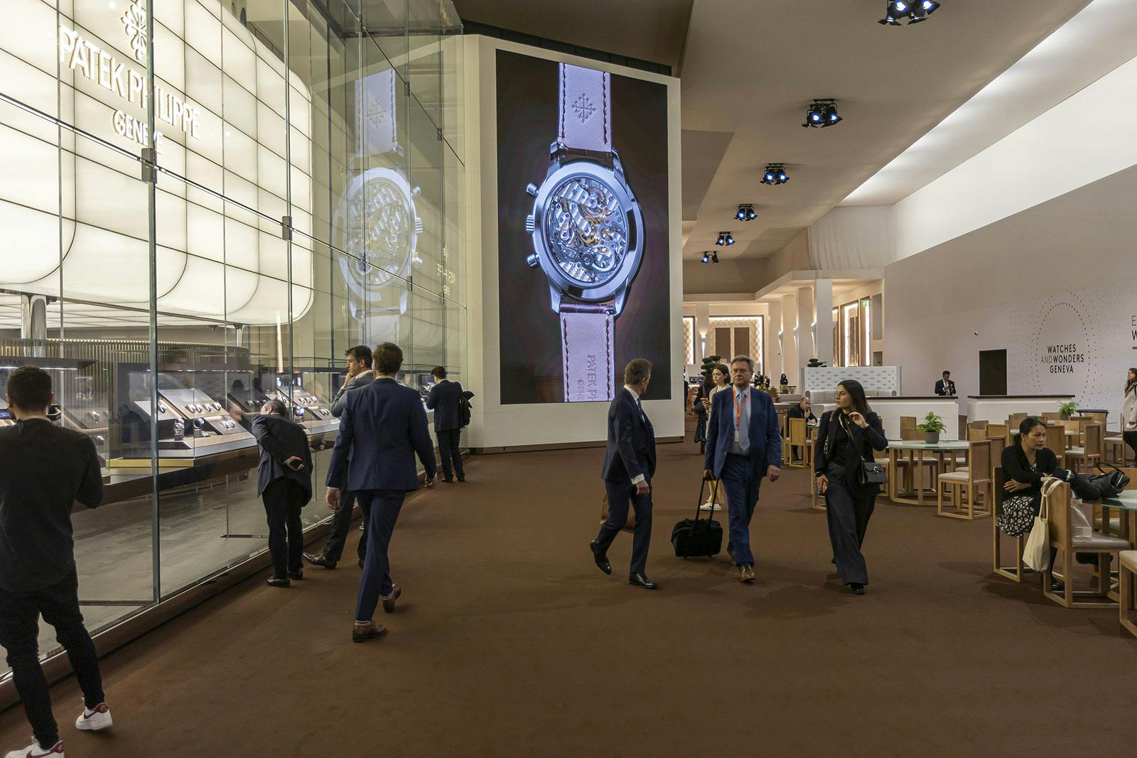 Another image showing how large the Watches and Wonders show is. In this case it shows you can look at the watches of Patek Philippe through the glass on the left hand side of the picture. 