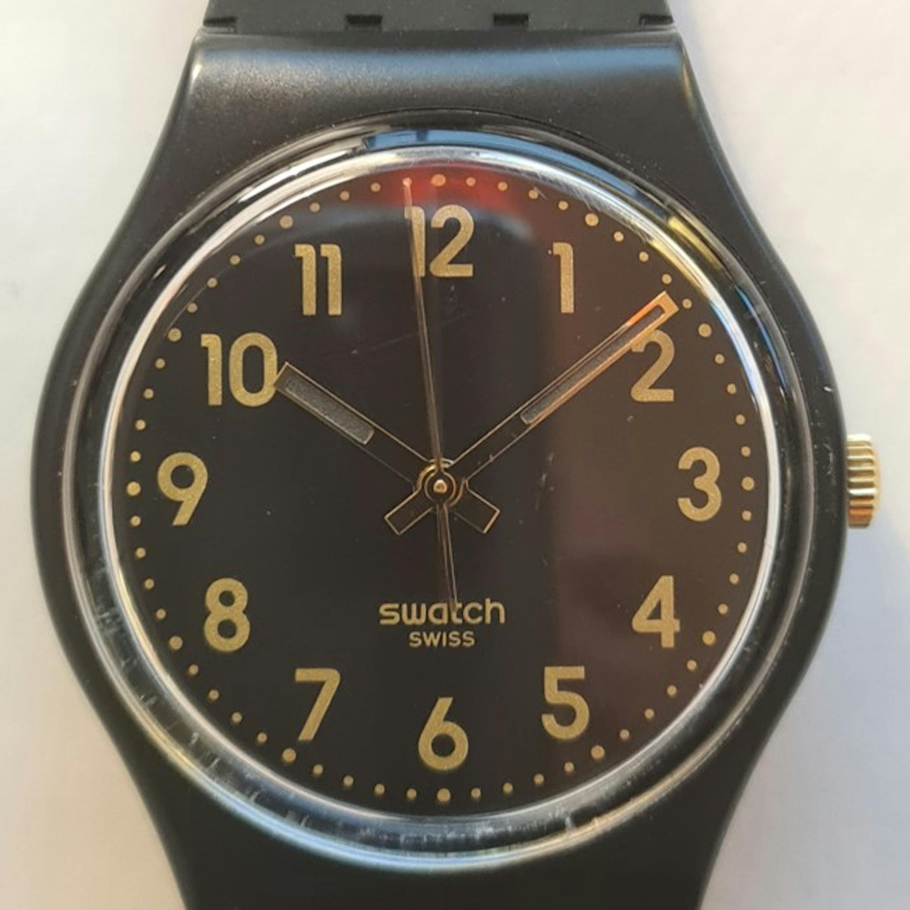 A Standard size men's Swatch. This design is unchanged since 1983, although the variety of dial, hands, numerals and strap colour runs to thousands of options.
