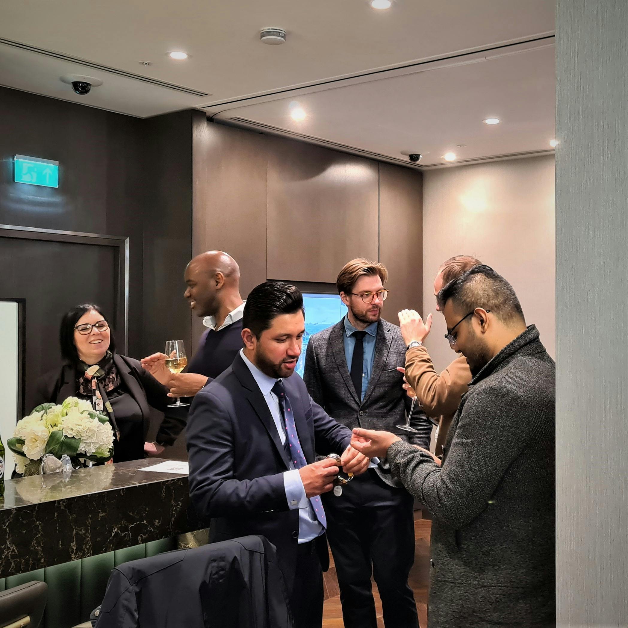 People at our Recent April Event with a Retail Partner talking about watches.
