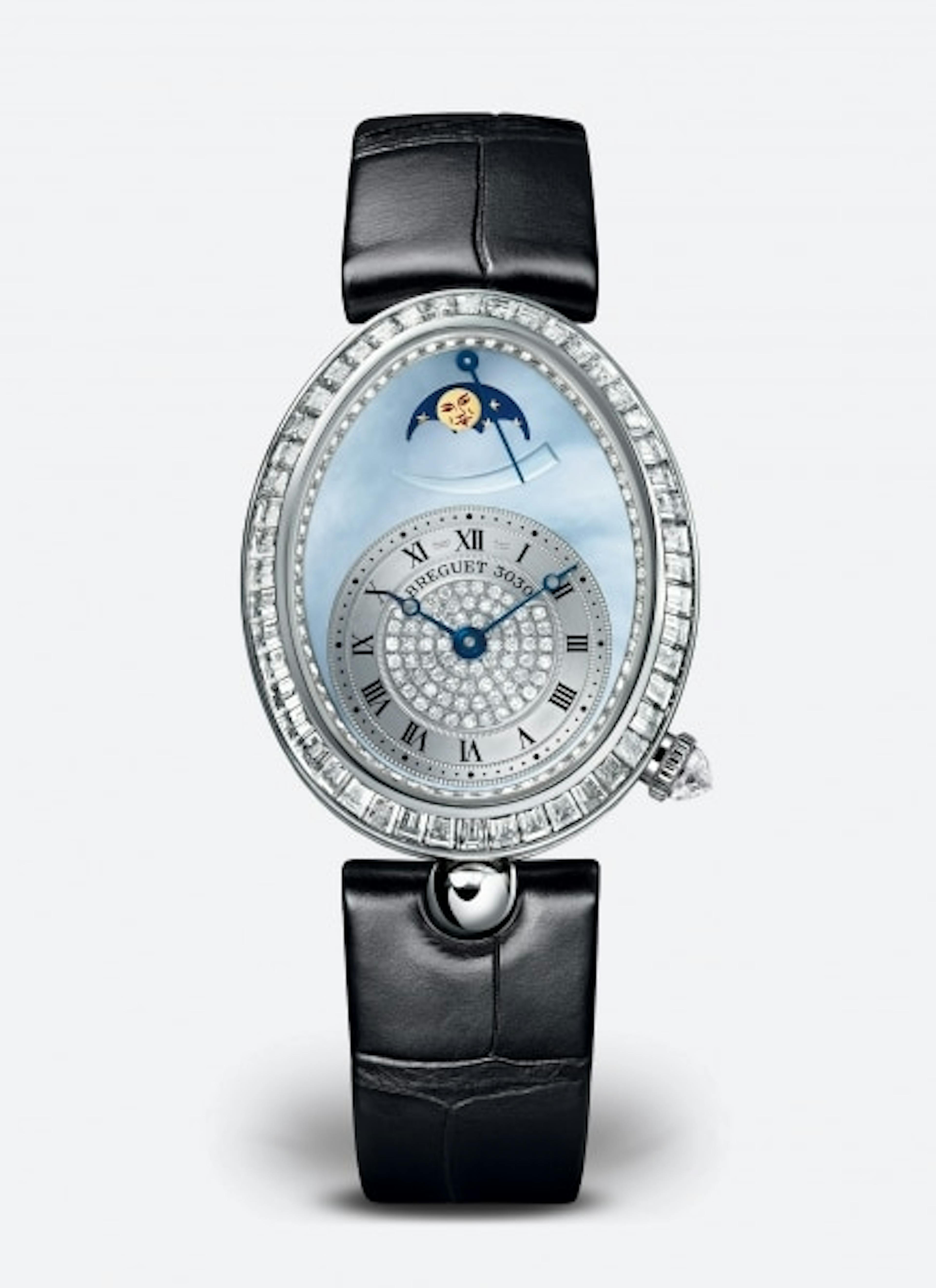 A piece from the modern Breguet Reine de Naples range featuring a mother of pearl and gold dial and baguette diamonds, alongside an automatic movement with moon phase and retrograde power reserve. A very fine example of a modern jewellery watch.