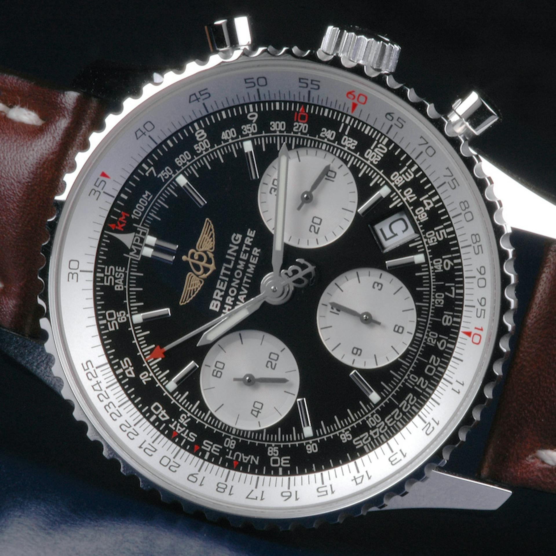 A Modern Breitling Navitimer in the classic colours, with a black dial and white Slide Rule Bezel.