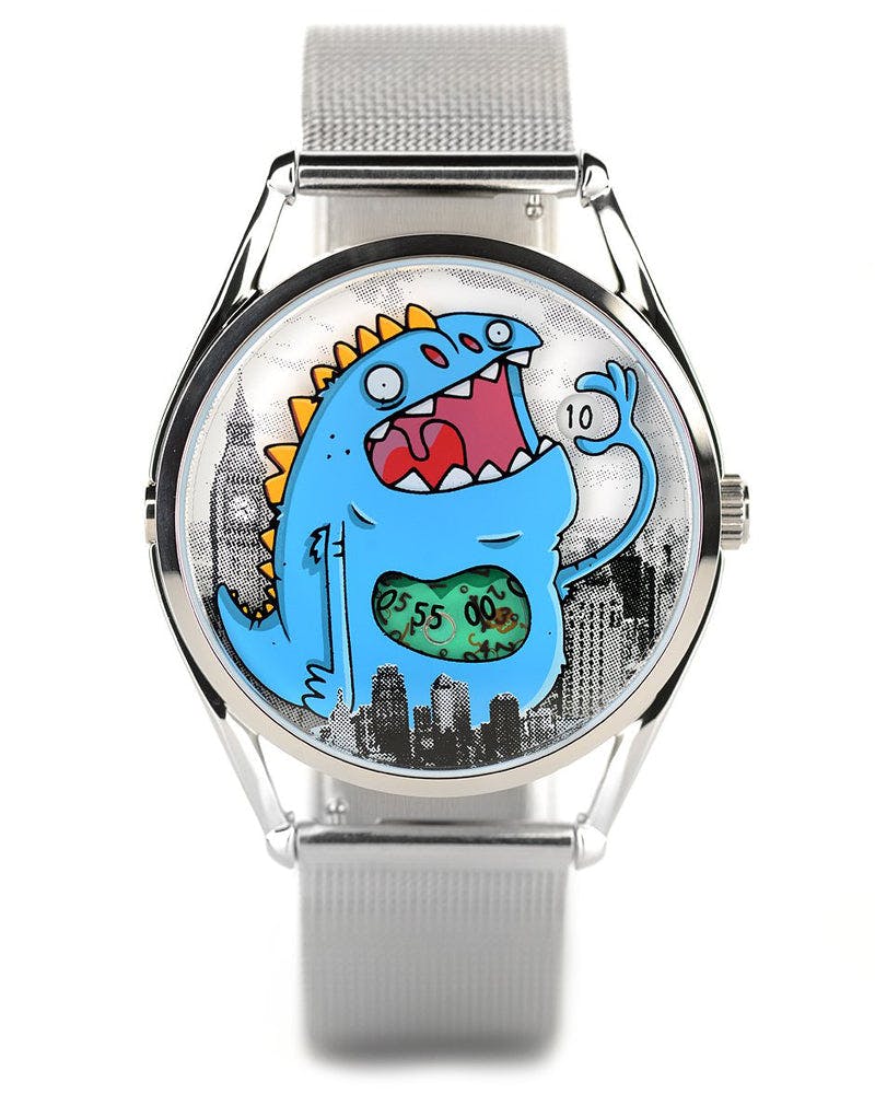 Watch with huge cartoon monster on the dial standing in a city of buildings from London on a grey strap