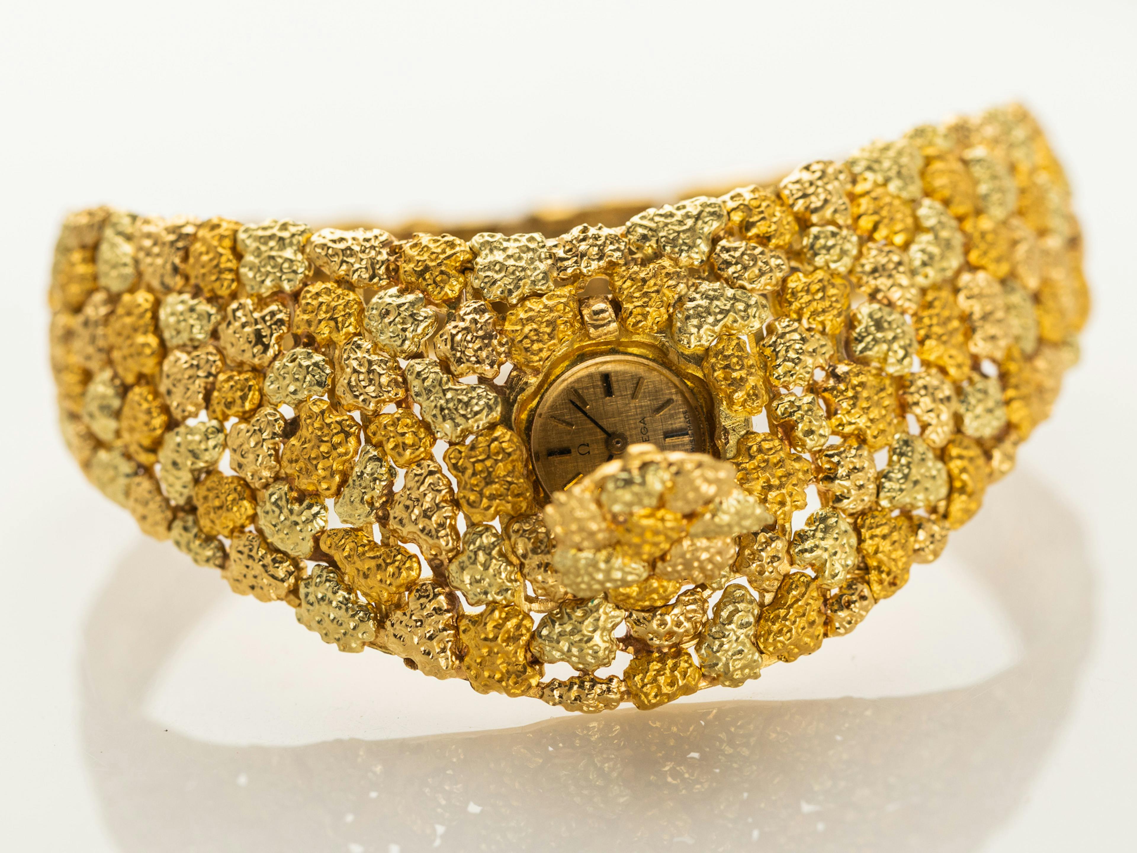 The Omega Ladies Bracelet watch by Gilbert Albert in full. A very 1960s watch design crafted in gold!
