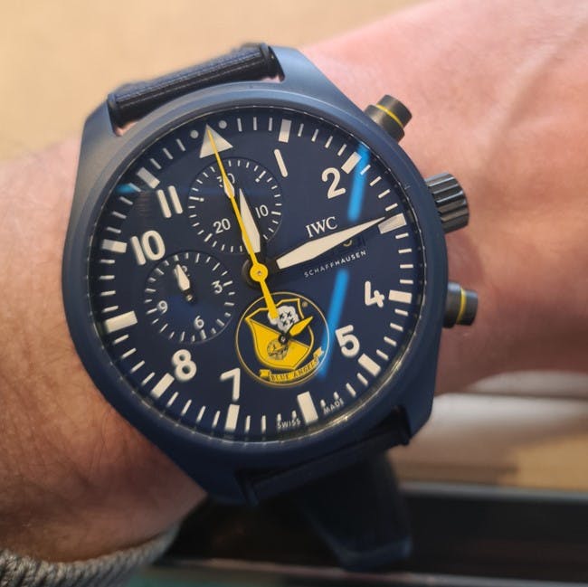 An IWC Big Pilot Blue Angels Pilot Watch showing clear features attributed to Pilot's watches such as the big luminous numerals, large hands, and chronograph, or stopwatch, function. 
