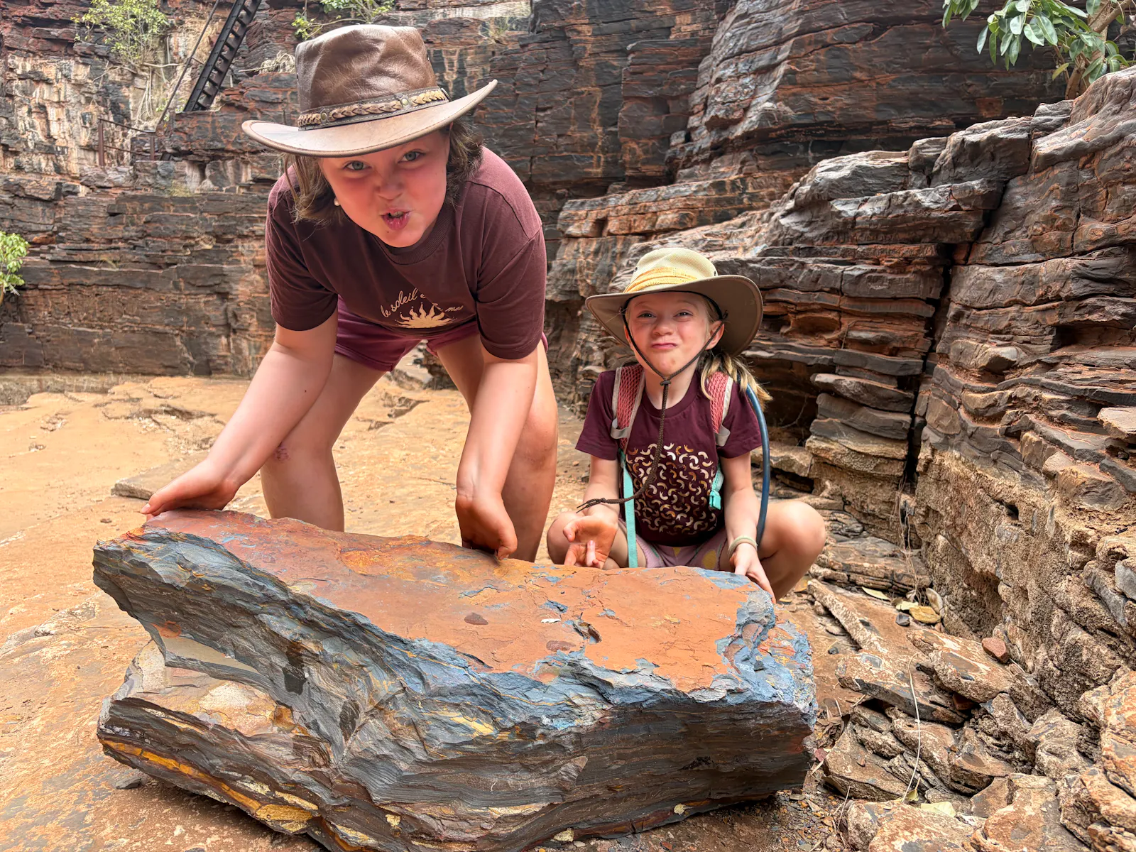Here they are trying out their strength / working on their acting with a big rock ๐.