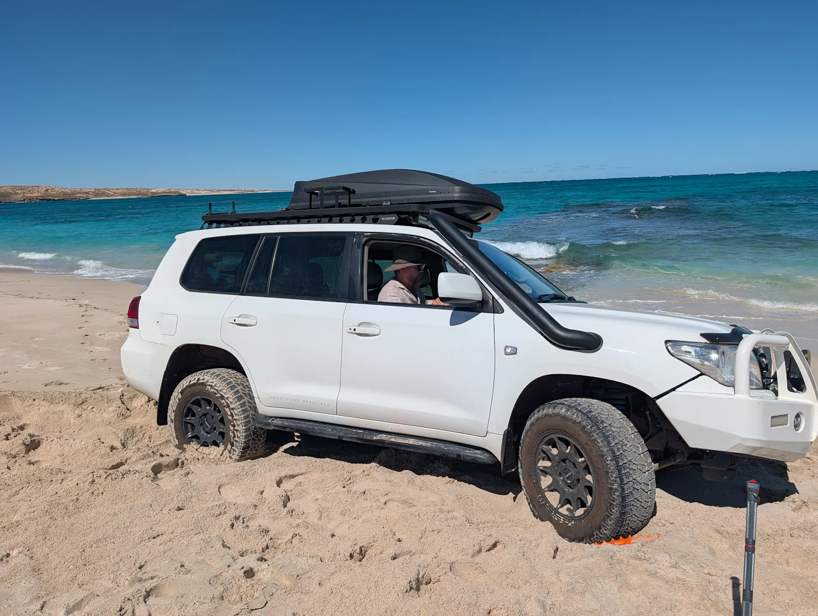 Yup, we got bogged in the soft wet sand just near the approaching waves....
