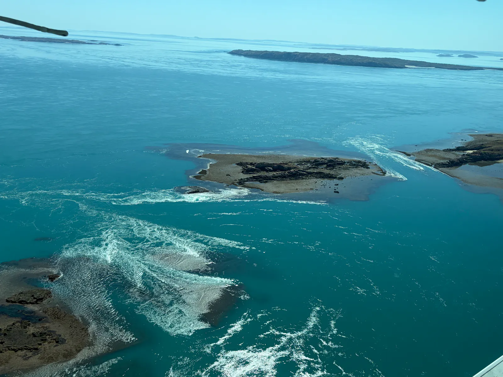 We could see the eddies and whirlpools from the air as the receding waters rushed past rocks or islands. 
