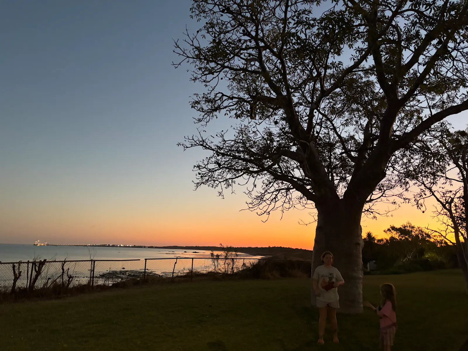 The girls attempting to collect boab nuts as the sun sets while we wait for our crepes to be ready. 