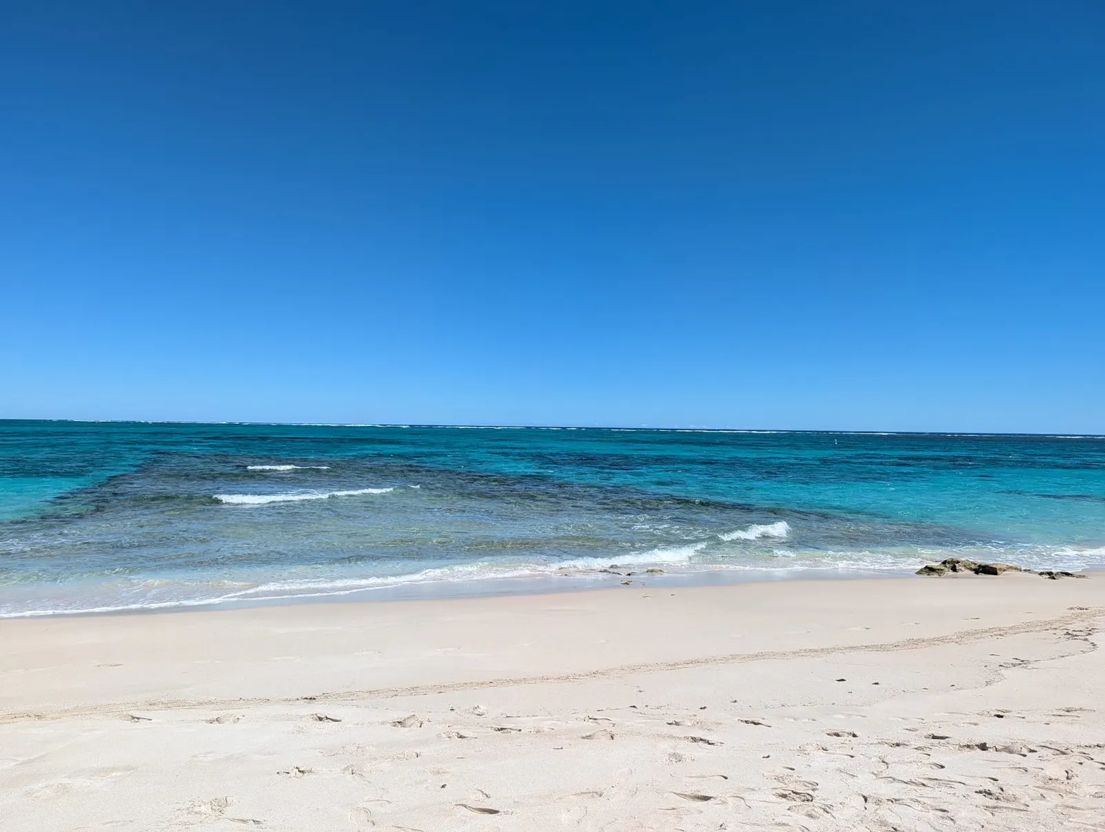 And there were 5 finger-like reefs running perpendicular to the beach that were the home to gorgeous and super colourful fishes and small rays.  