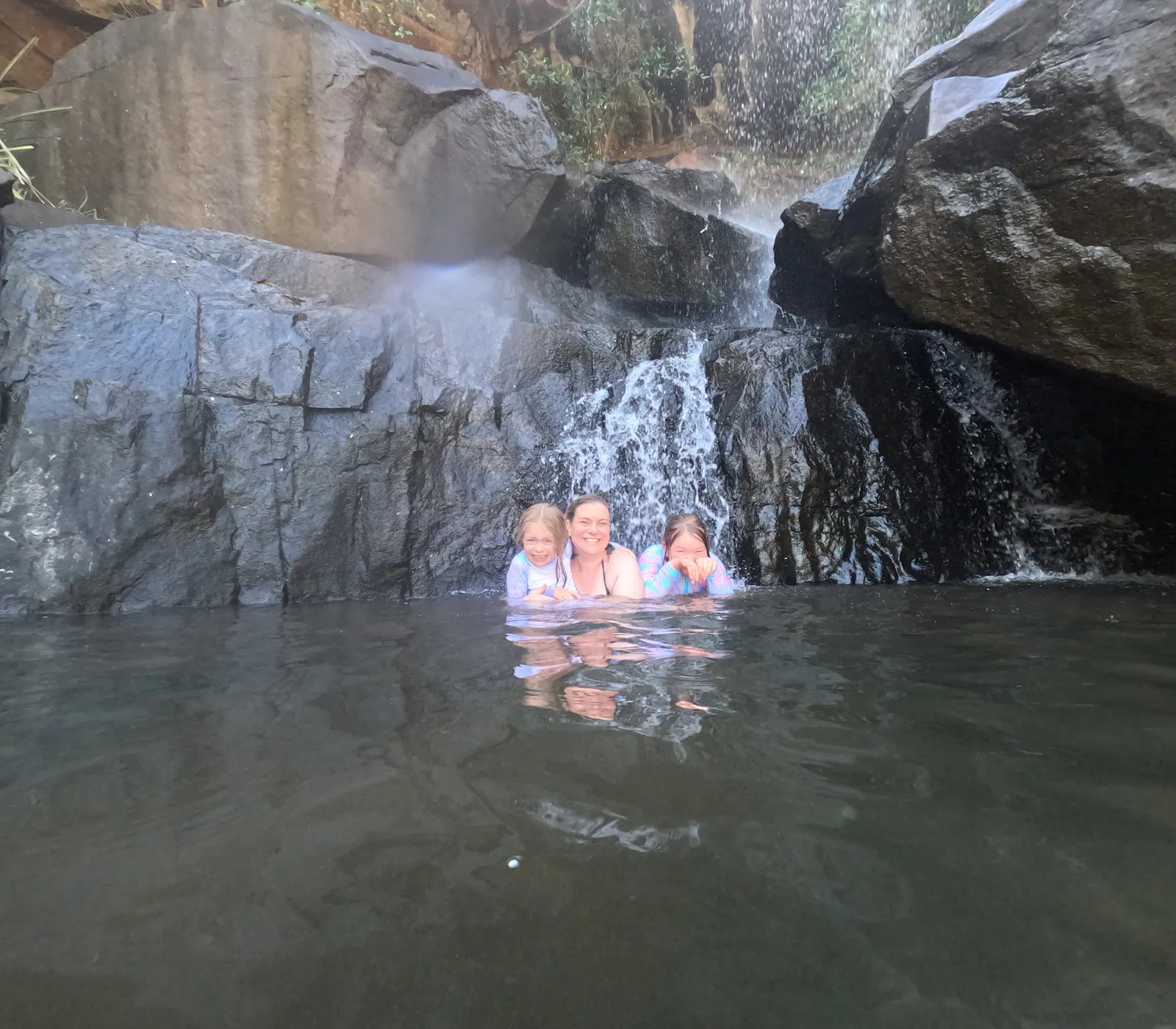Me and the girls huddling under the very cold water from the waterfalls 🥶.