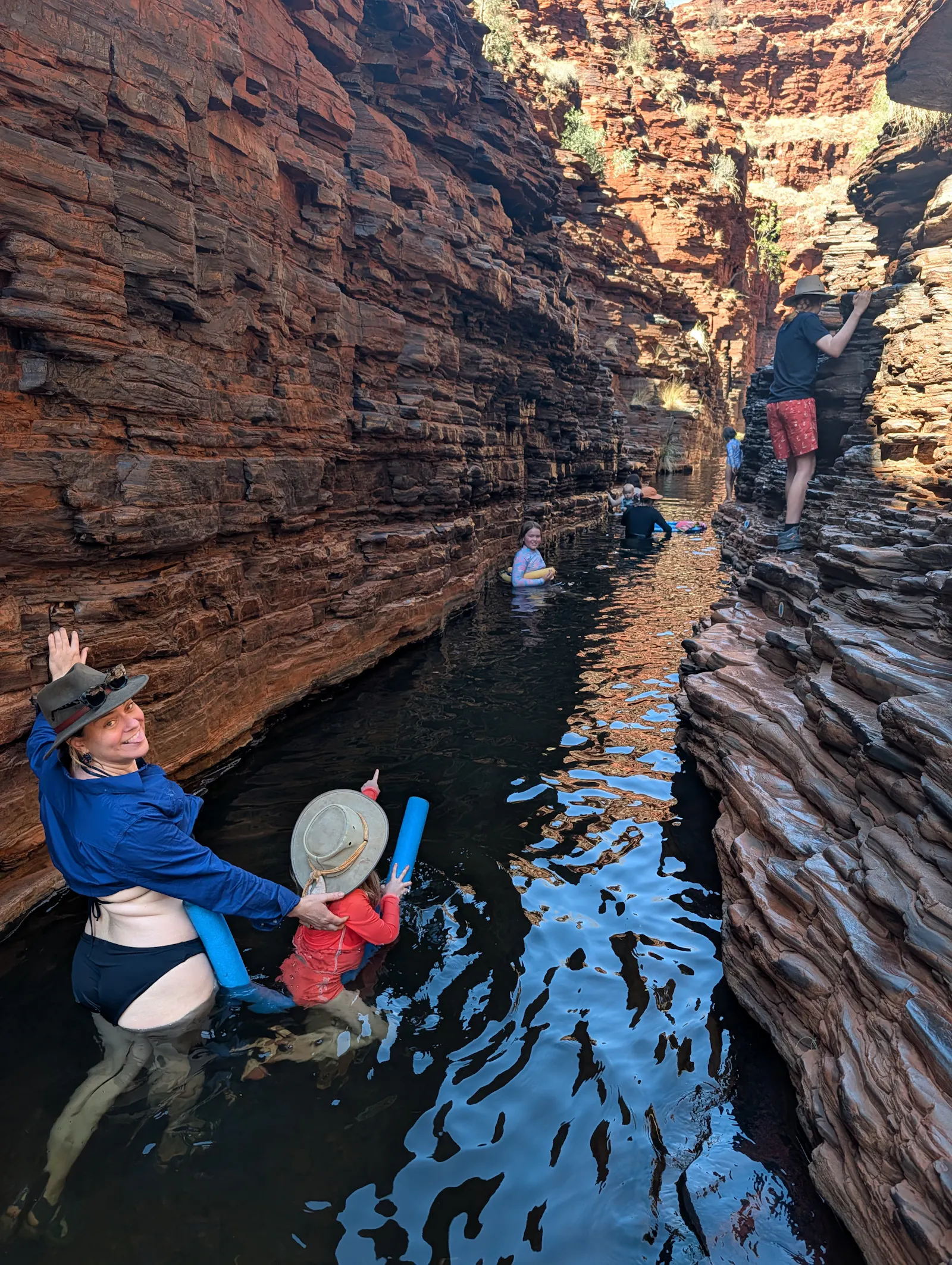 Toby rock climbing up the top and me, Nora and Josie wading down below, Josie with the assistance of a trusty pool noodle.