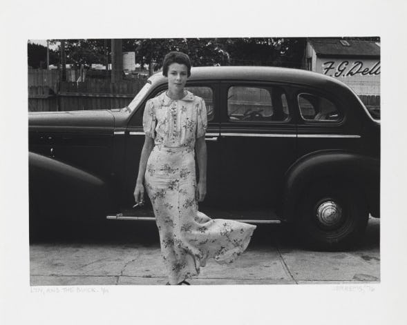 CAROL JERREMS, LYN AND THE BUICK, (1976) GELATIN SILVER PHOTOGRAPH NATIONAL GALLERY OF AUSTRALIA, CANBERRA GIFT OF MRS JOY JERREMS 1981 © THE ESTATE OF CAROL JERREMS IMAGE COURTESY THE ESTATE AND NGA