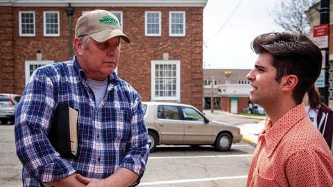 Kenyon student George Costanzo and Pastor Bill Dunfee of New Beginnings Church talk in the Mount Vernon town square.