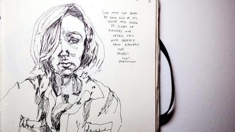 An inked self portrait from the notebook of Sarah Nourie. Next to the portrait is a handwritten quote: "She took the book by each end of its spine and shook it. Scores of flowers and petals fell and drifted between the pages."