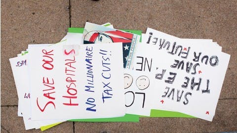 Protestors' signs piled on the Mount Vernon sidewalk
