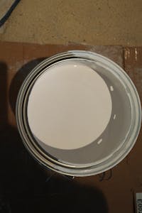 Clean paint can with drip holes
