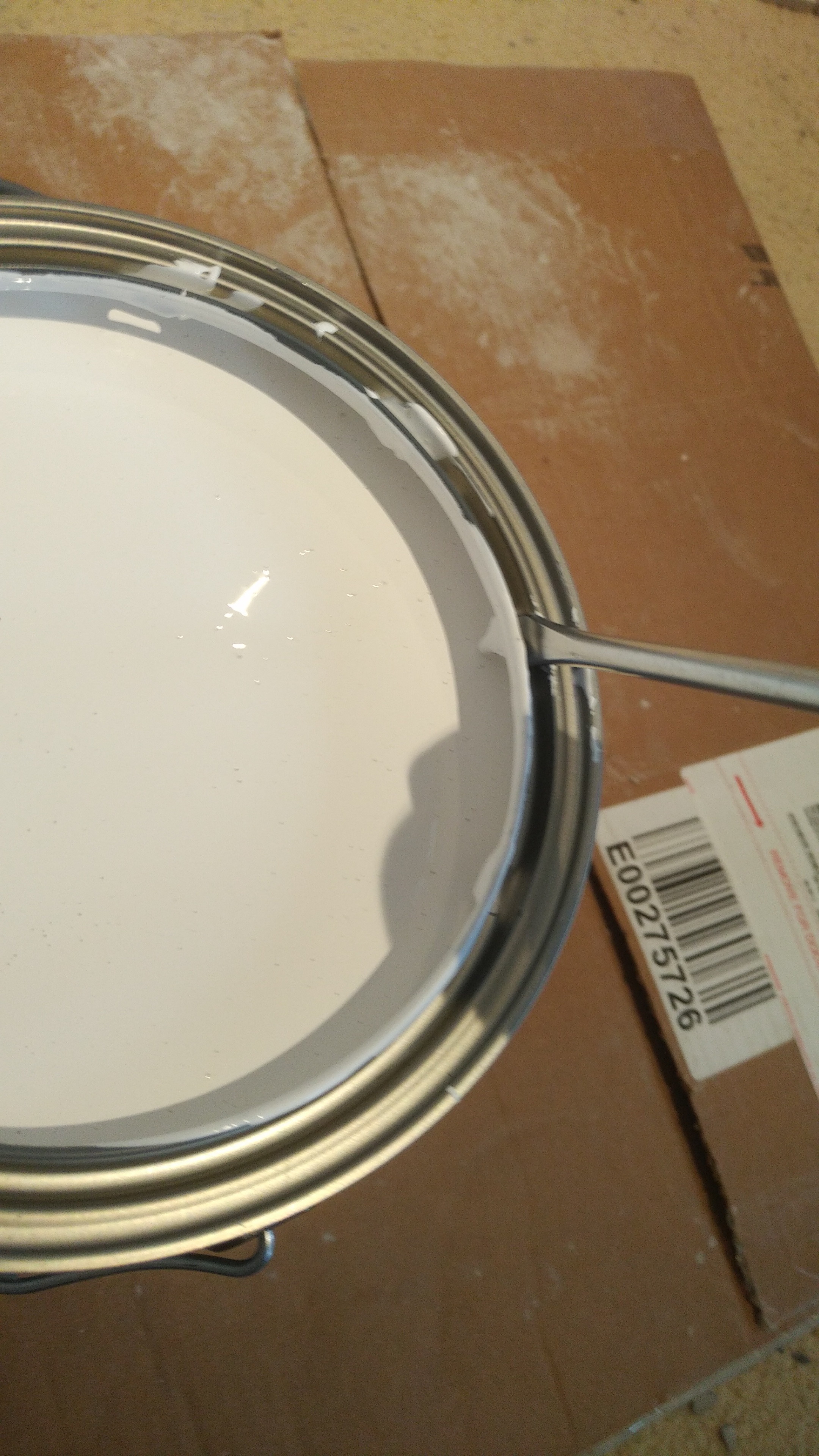 Knocking holes in paint can lip