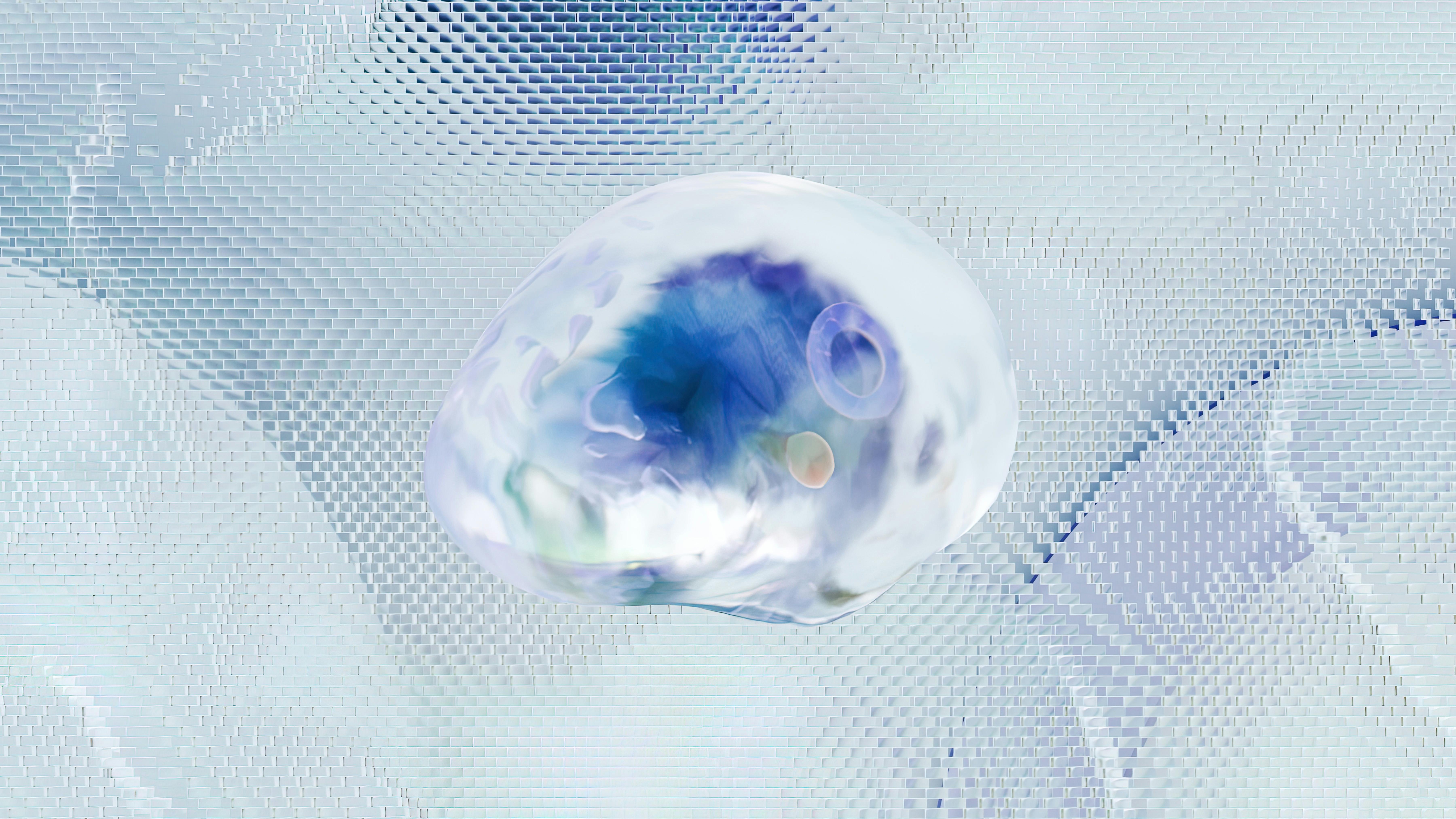A semi-liquid, glossy orb containing a blue neuron-like entity. The orb floats against a textured, gray background with a futuristic, tech-like appearance.