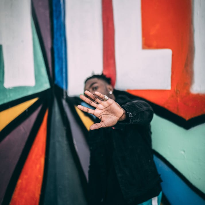 Man with hand up