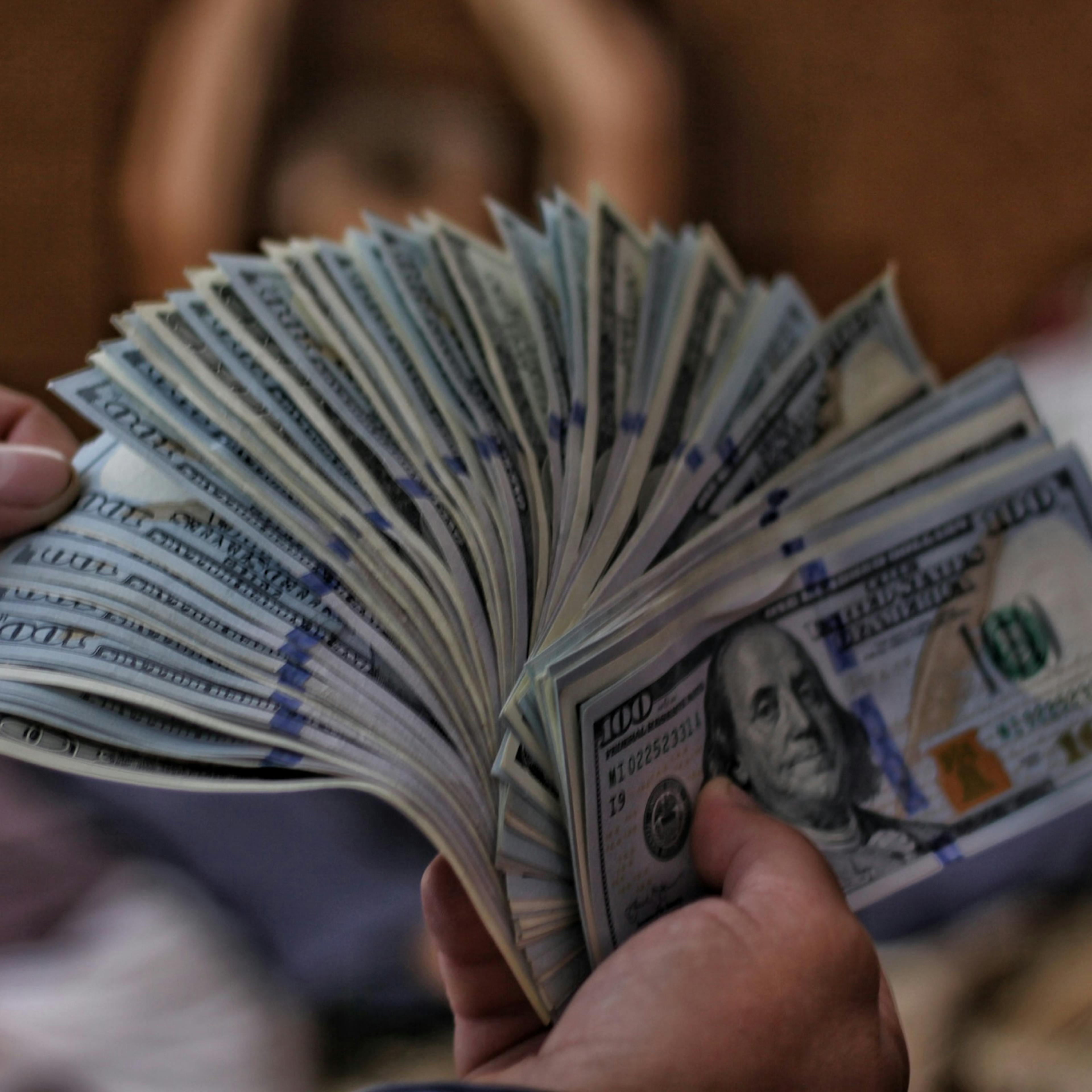 A client shows a sex worker how much they're willing to pay for their services.