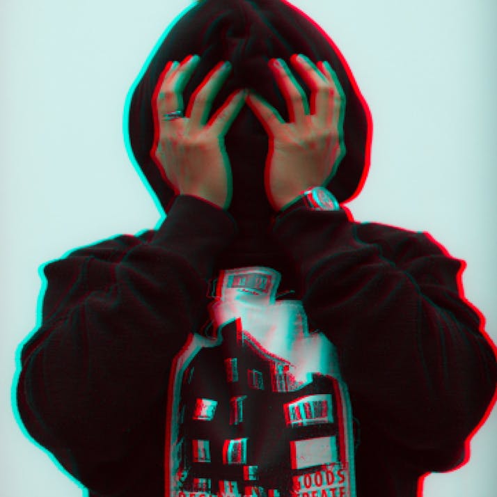 Man covering face