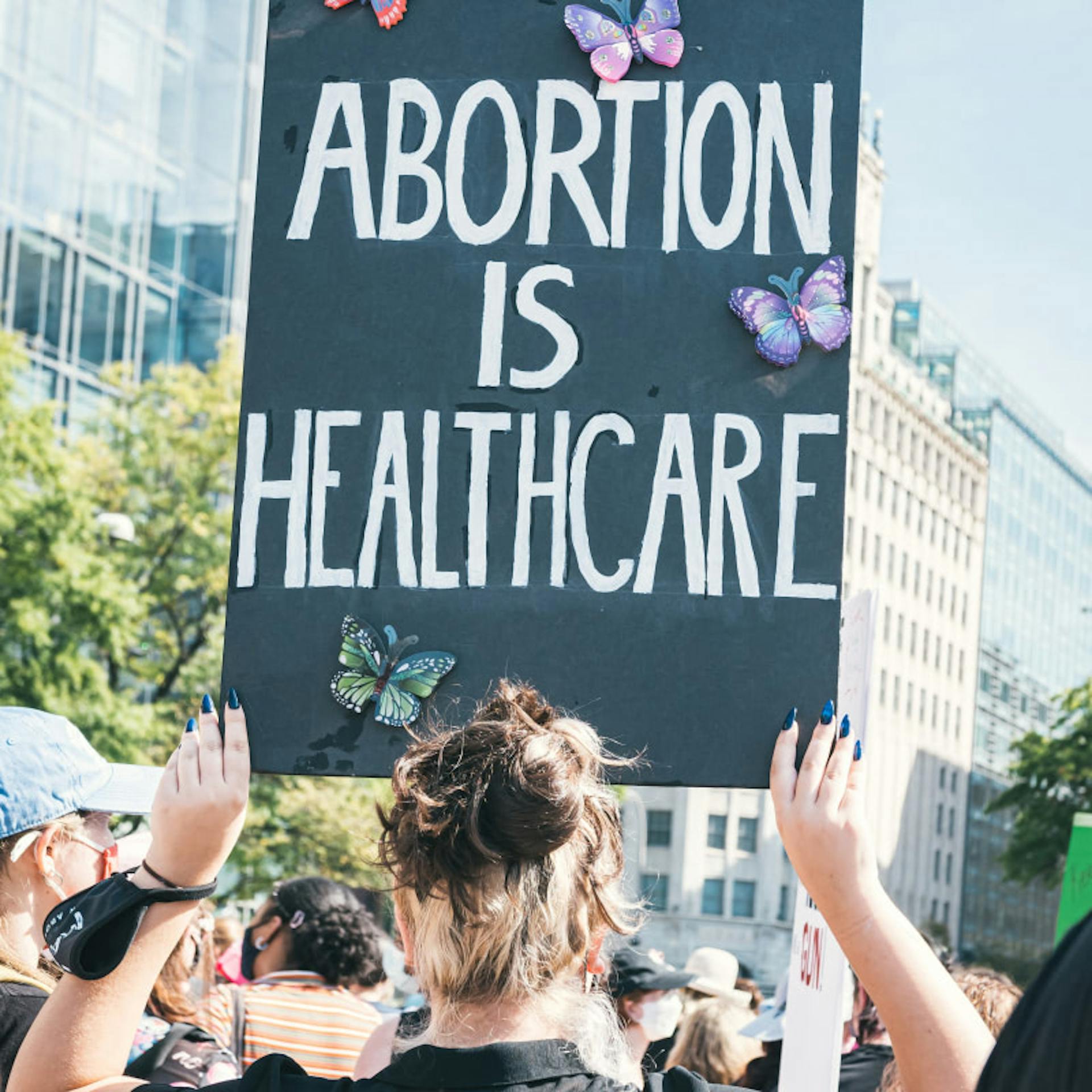 A protest sign reading "abortion is healthcare"