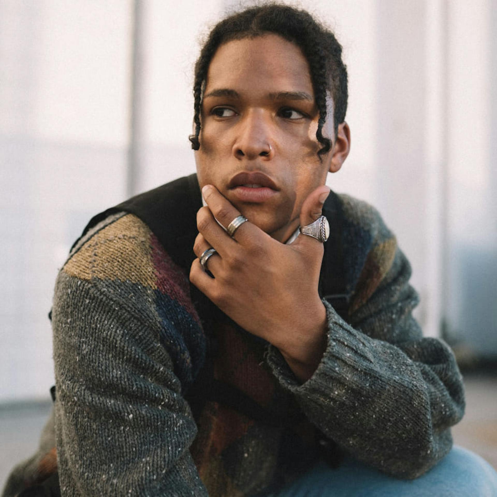A man wearing three rings to remind himself of the different stages of his life.