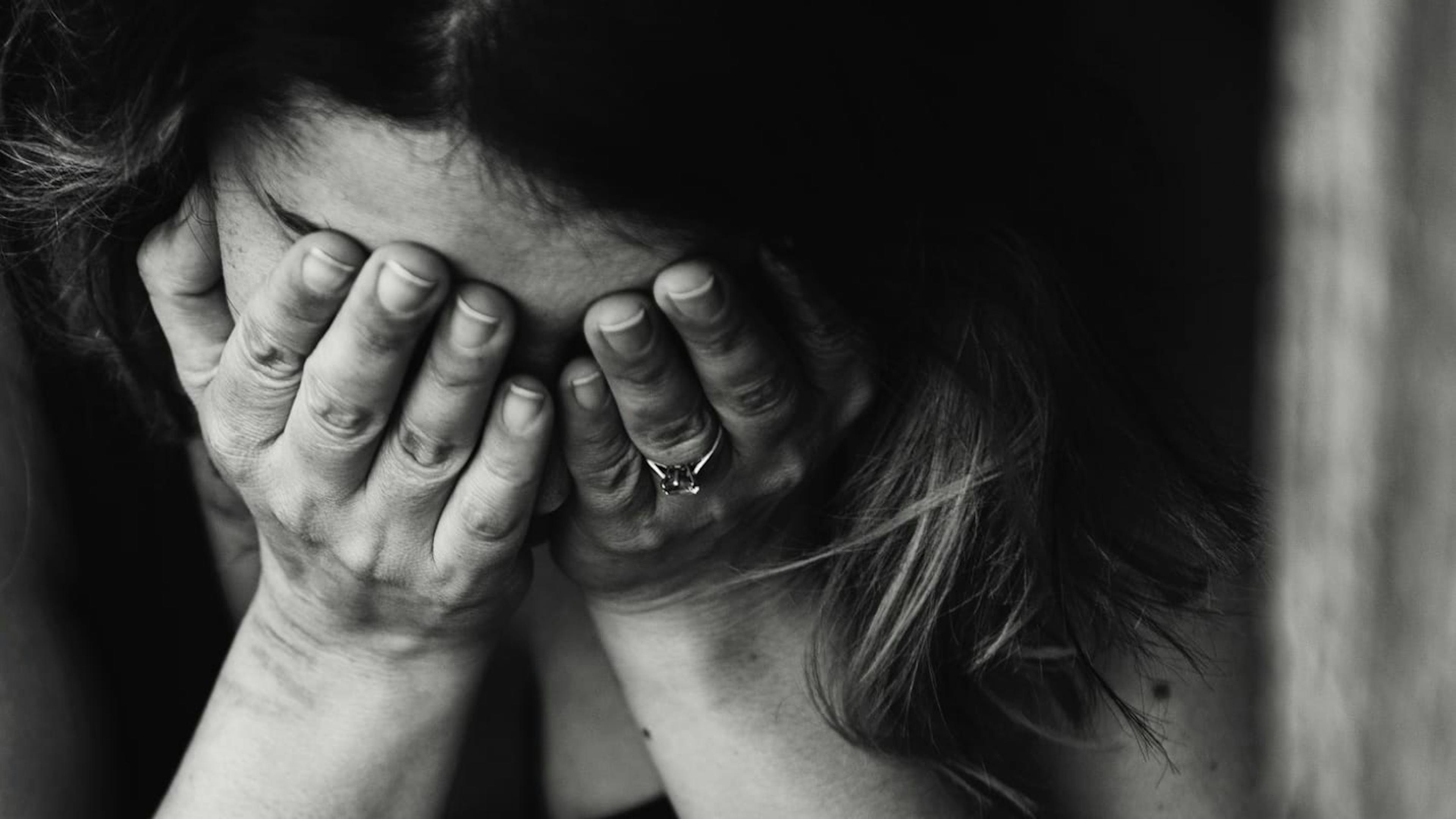 A married woman weeps after breaking up with the man she was having an affair with.