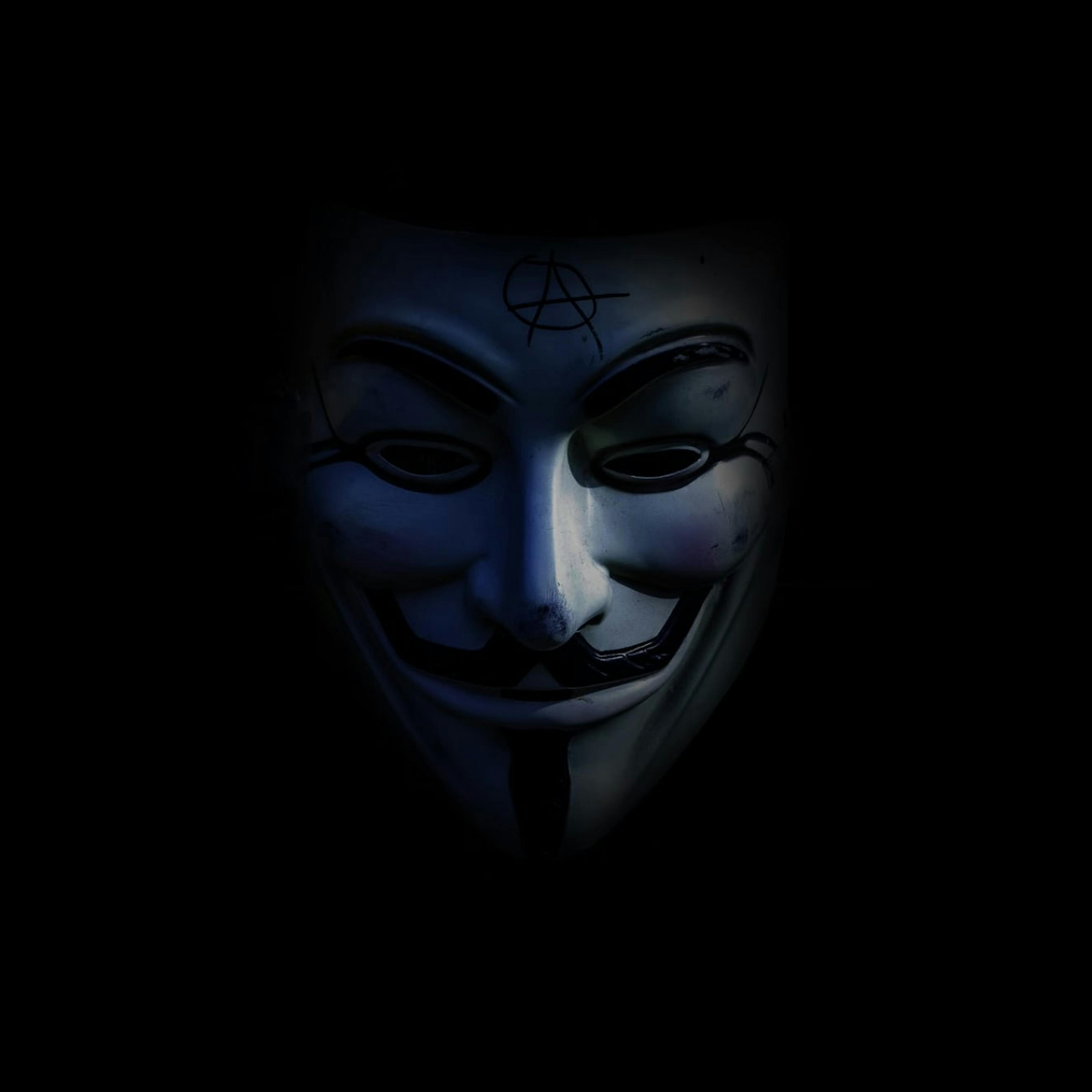 A Guy Fawkes mask is the trademark of hacktivist group, Anonymous.