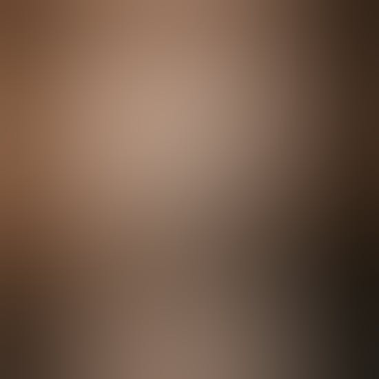 A person backlit by the spotlight of being in the public eye.