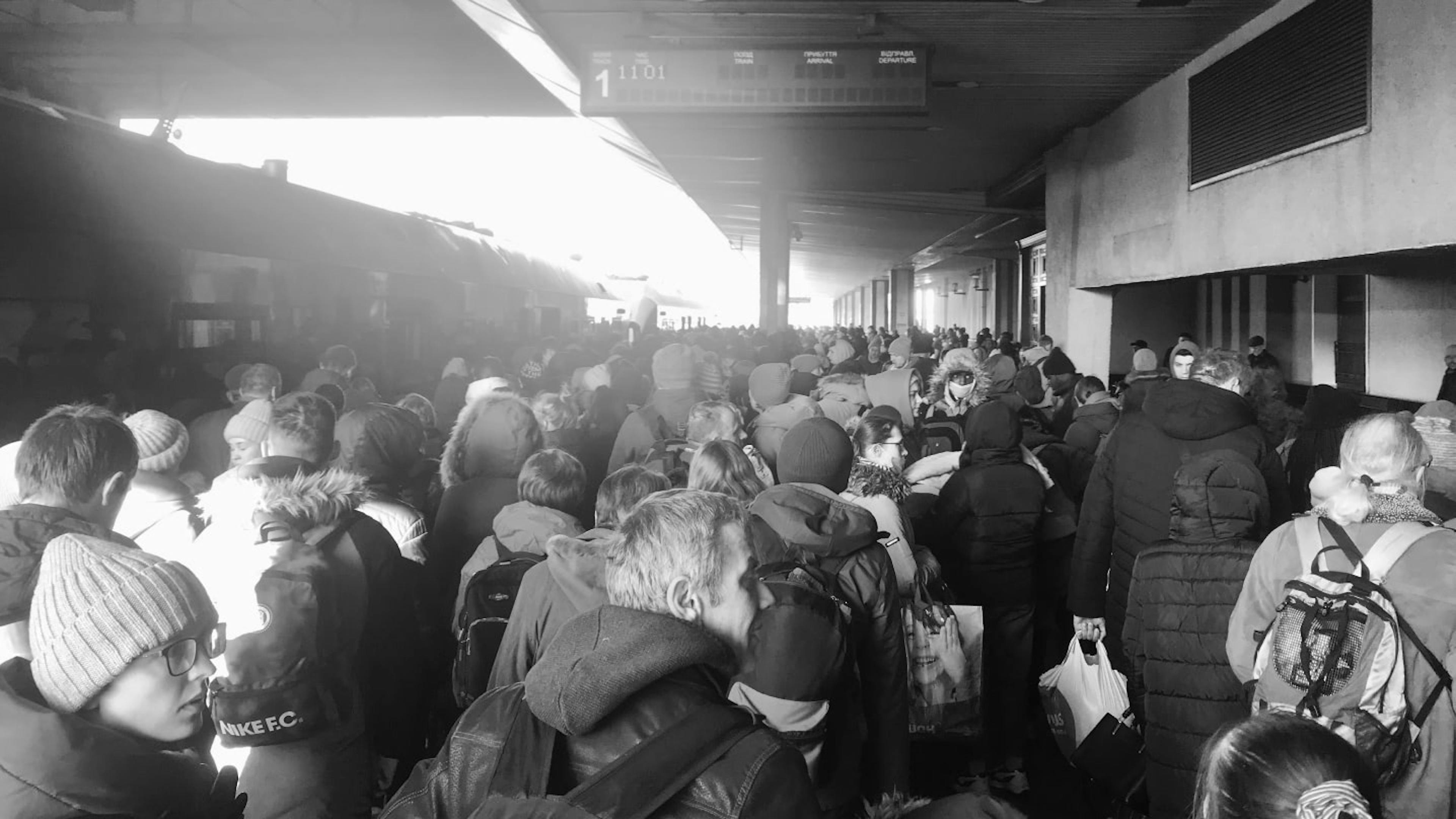 Crowds of people at a Kyiv train station fleeing the city.