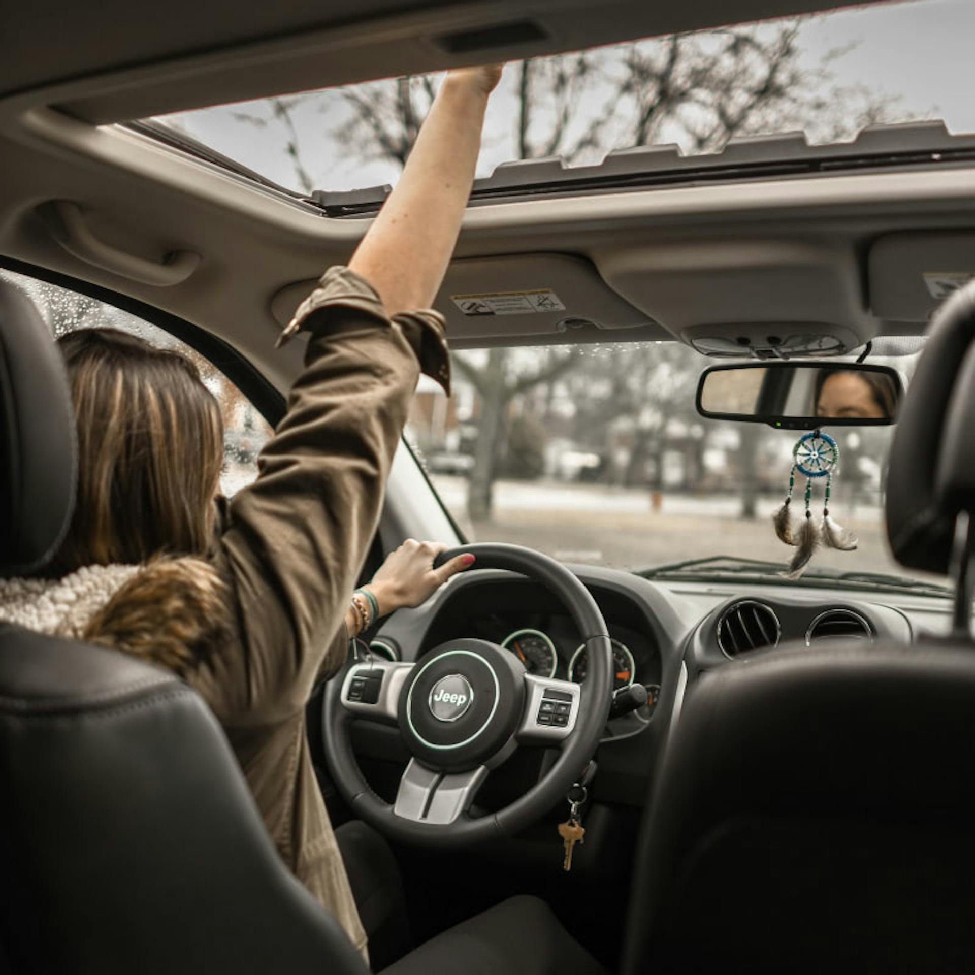 A young woman celebrates being legally able to drive.