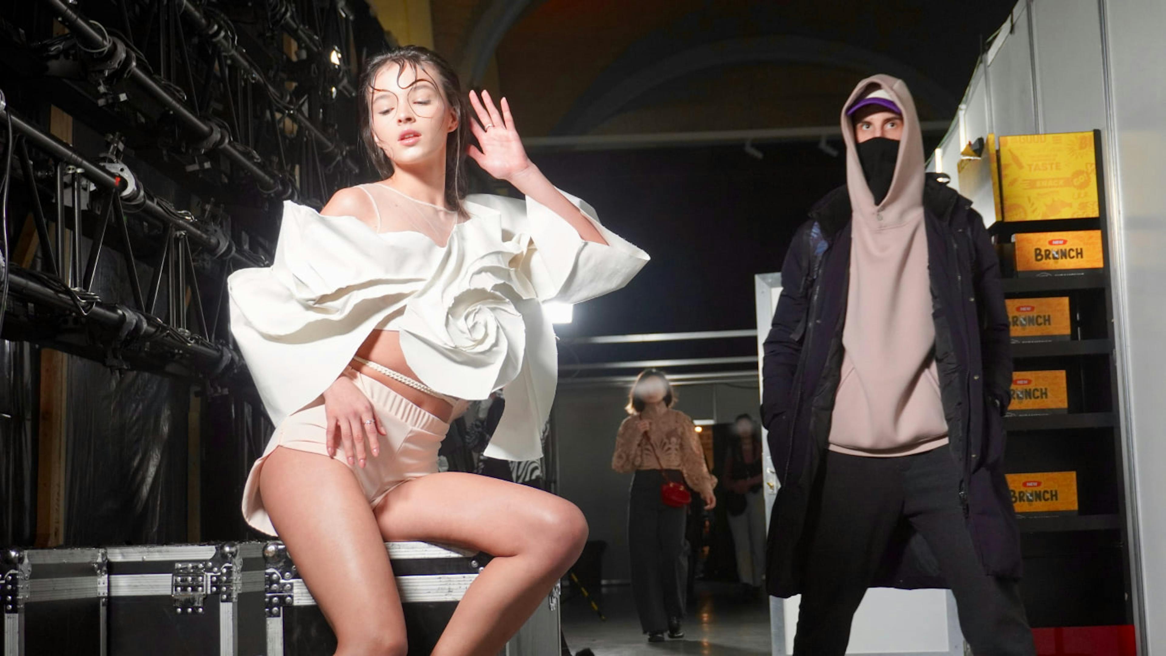 A Ukrainian model striking a pose backstage at Ukrainian Fashion Week.