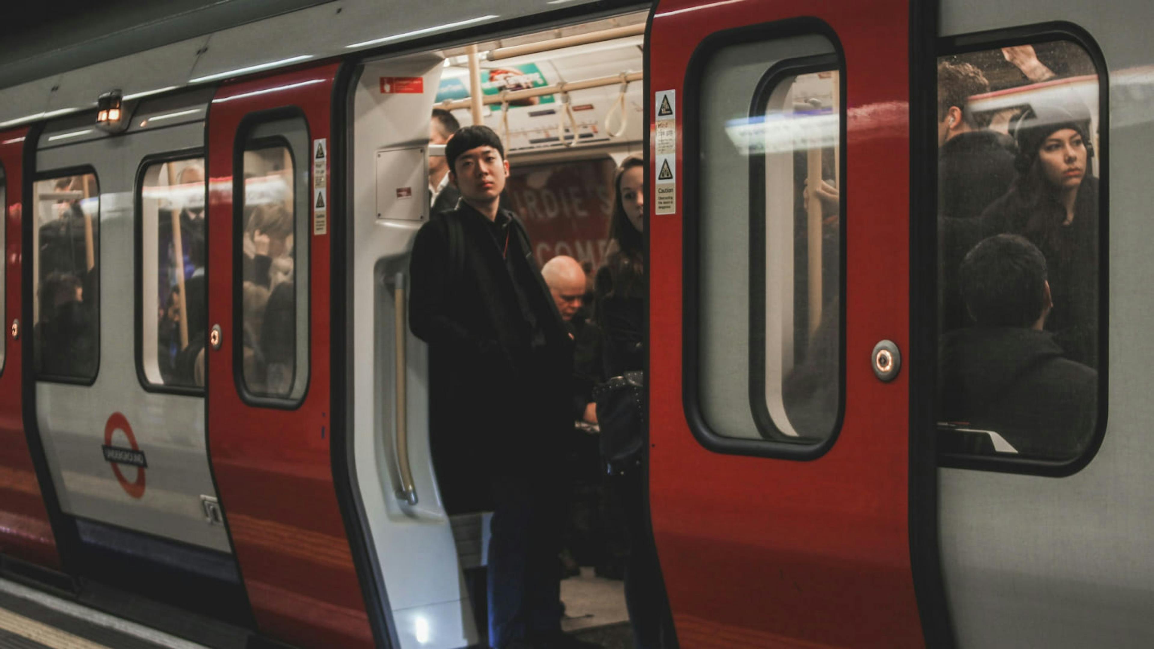 A man riding the underground in London.