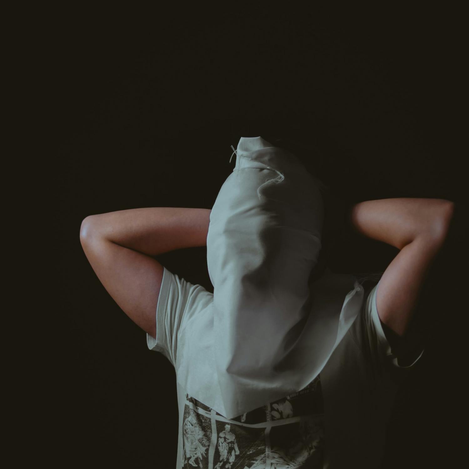 Man with waterboarding cloth over face